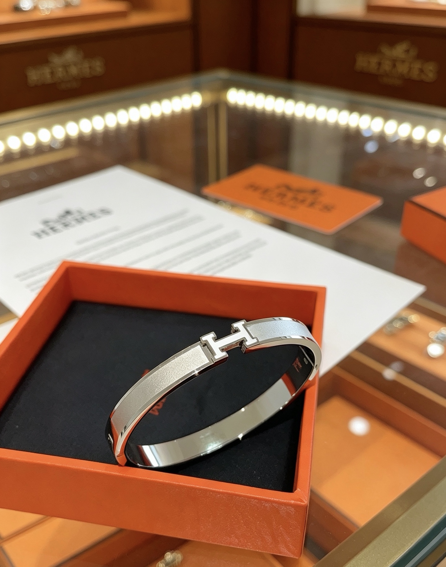 Hermès gold-tone bracelet, shown in the complete original source image set. 7