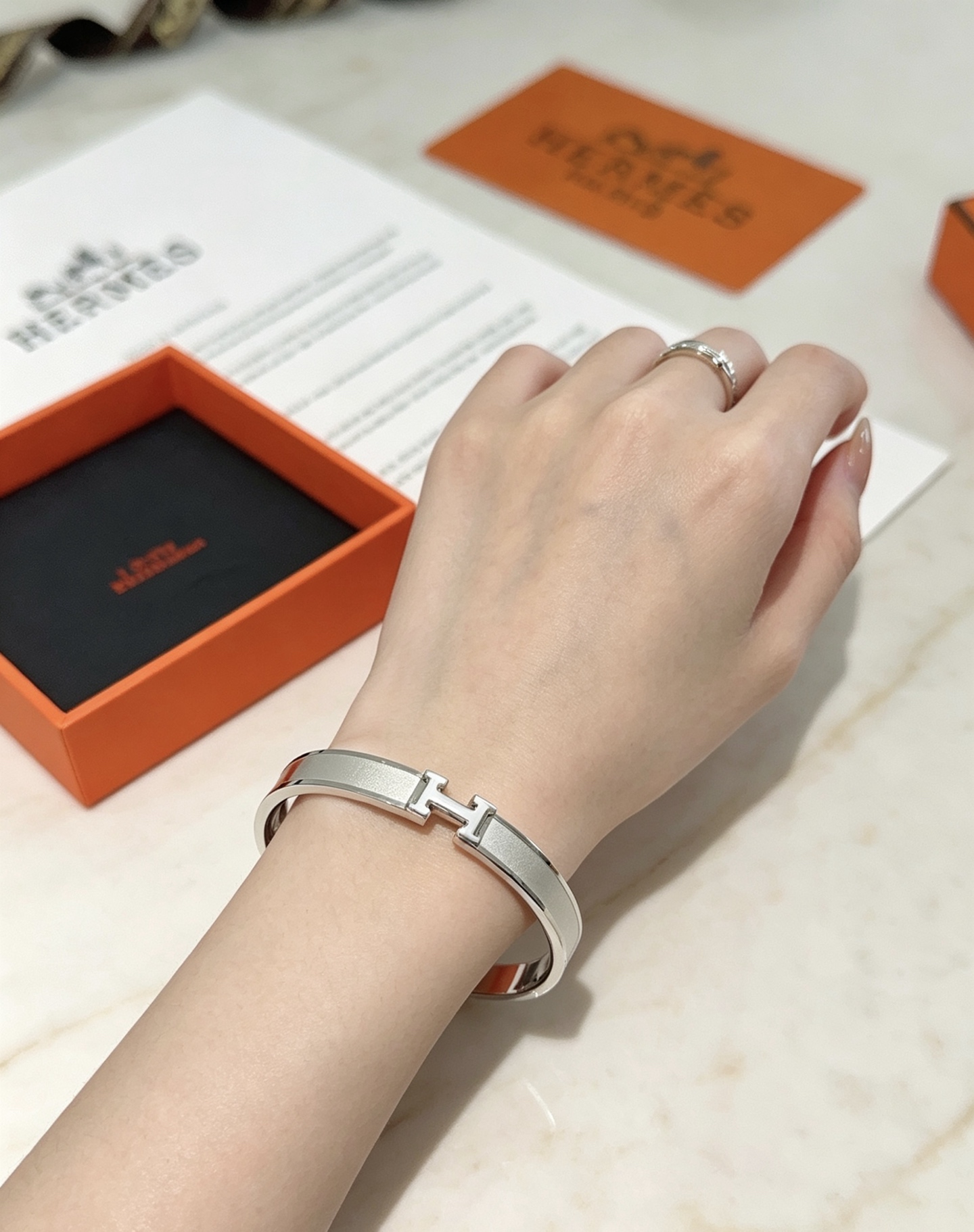 Hermès gold-tone bracelet, shown in the complete original source image set. 8