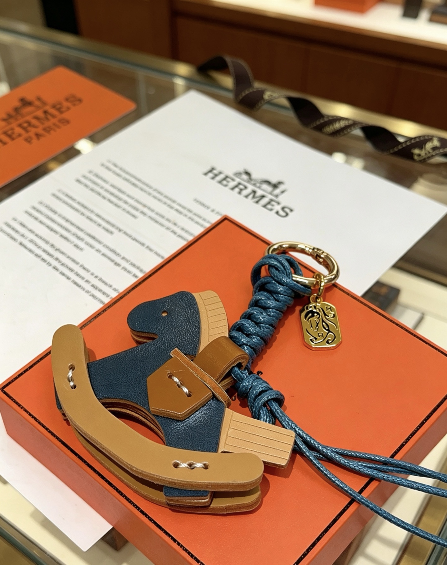 Hermes Rocking Horse Bag Charm pendant Gold-tone metal deep blue braided cord deep blue tan and light beige leather 12cm total length