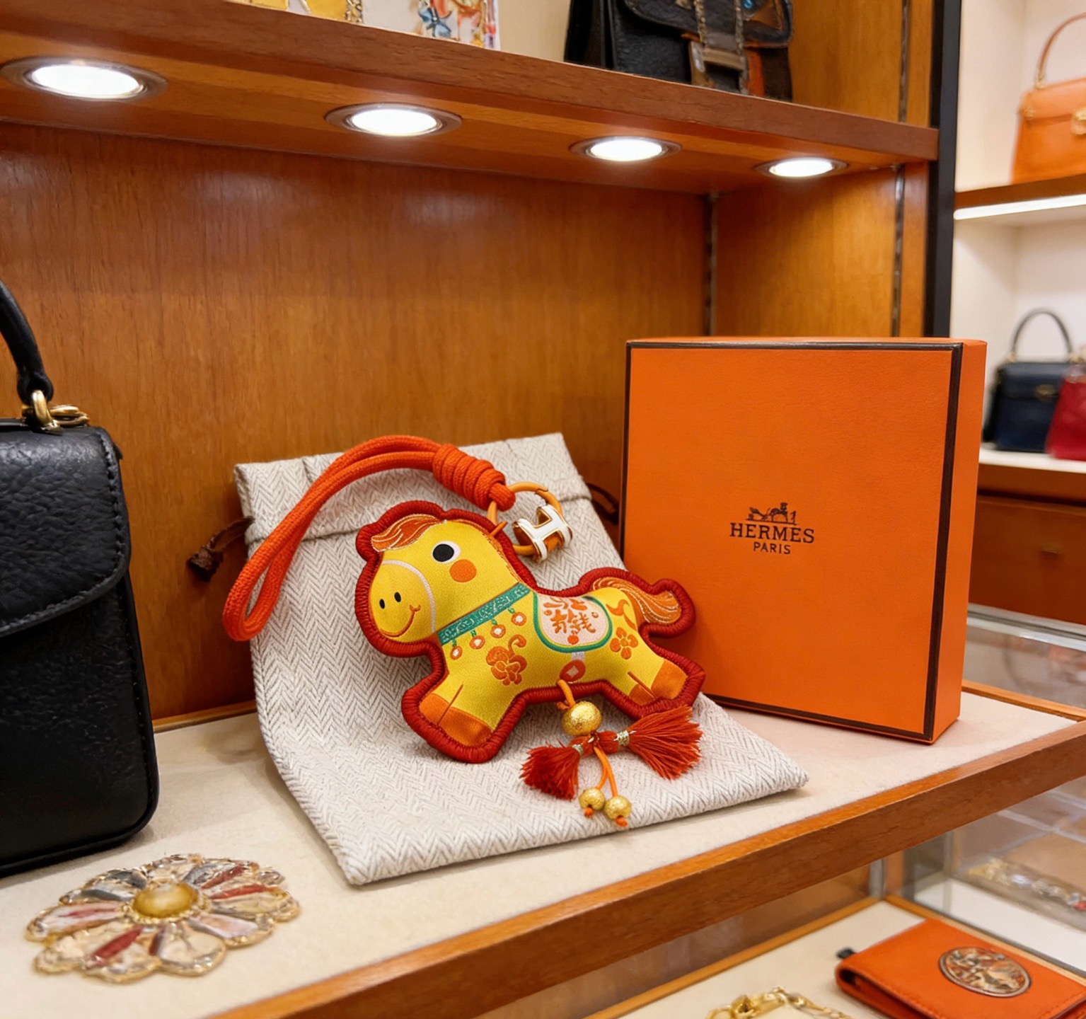 Hermes Year of the Horse Lucky Horse Bag Charm pendant Yellow fabric with red trim orange cord silver-tone H hardware gold-tone bead accents orange and red tassels 12cm total length with strap