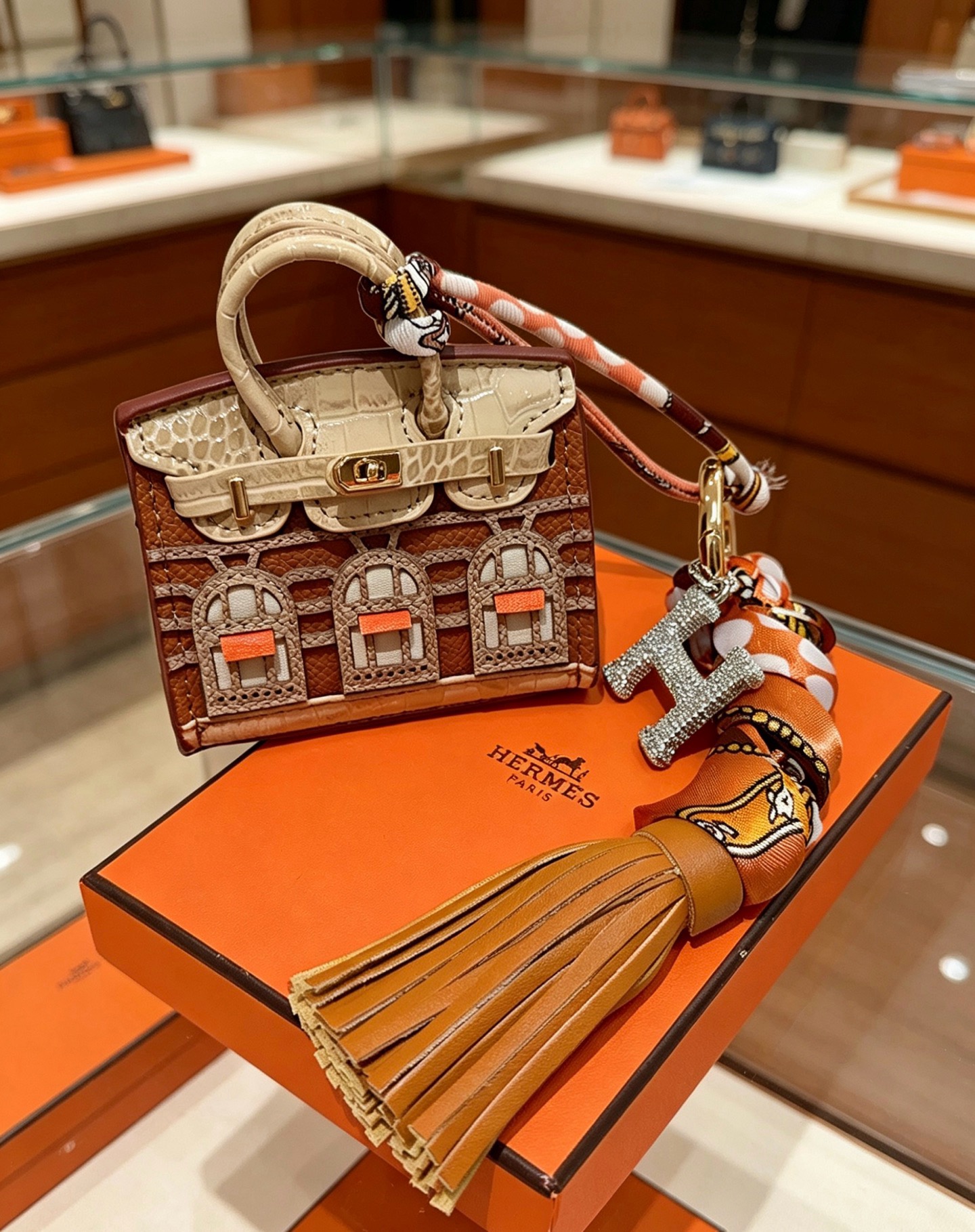 Hermes Birkin Faubourg Micro Bag Charm pendant Gold-tone metal brown beige orange leather orange brown beige silk clear crystal stones Total length 18cm