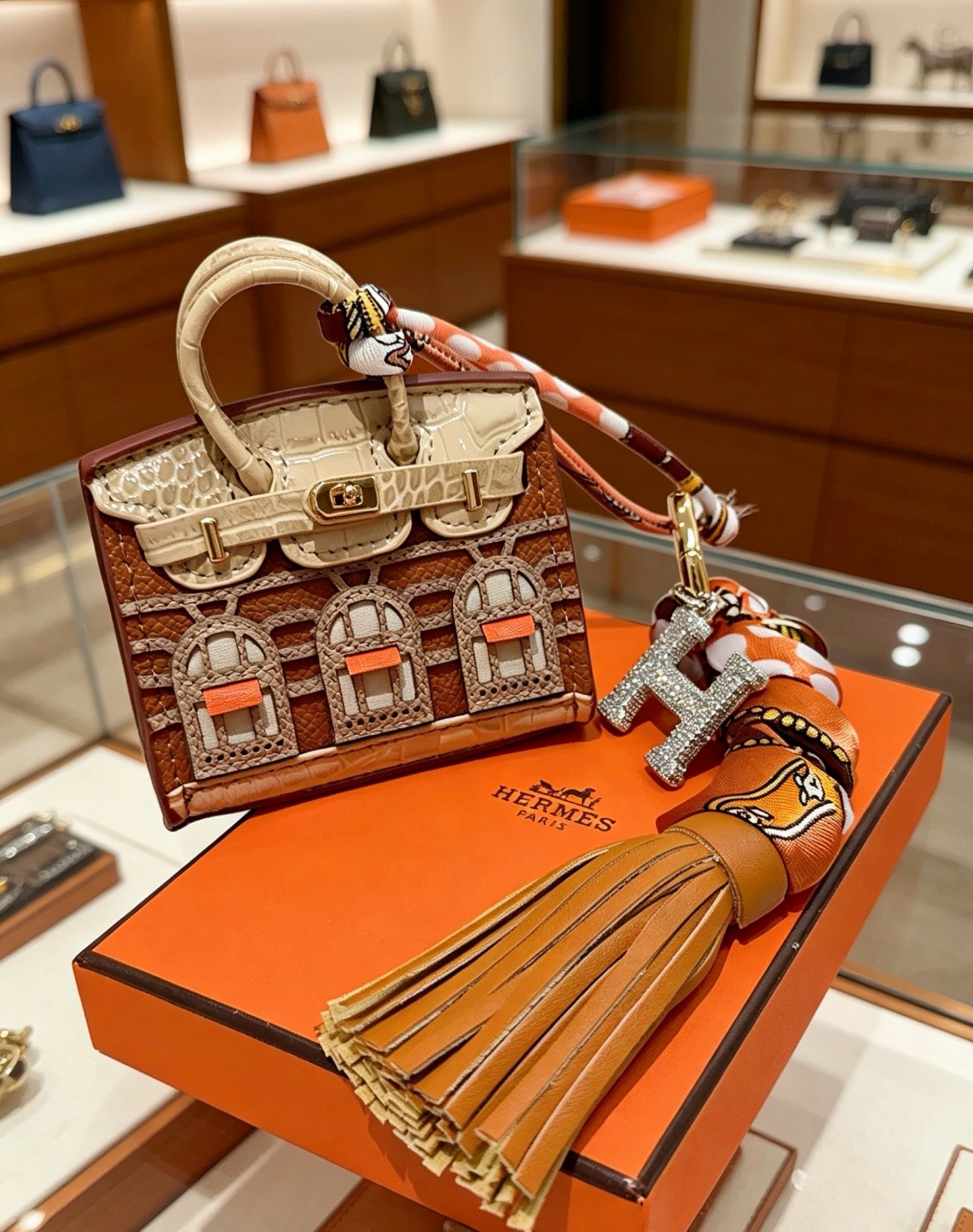 Hermes Birkin Faubourg Micro Bag Charm pendant Gold-tone metal brown beige orange leather orange brown beige silk clear crystal stones Total length 18cm