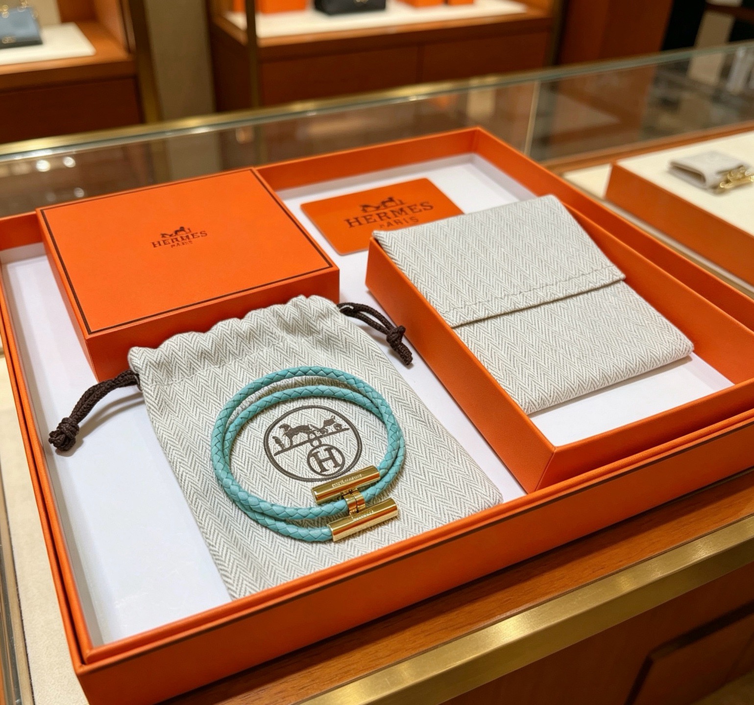 Hermes Tournis Tresse bracelet Gold-tone metal turquoise braided leather 18cm