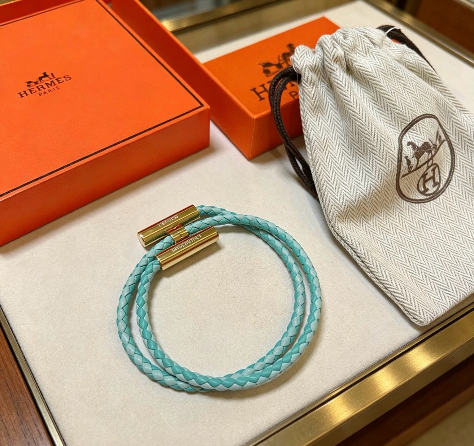 Hermes Tournis Tresse bracelet Gold-tone metal turquoise braided leather 18cm
