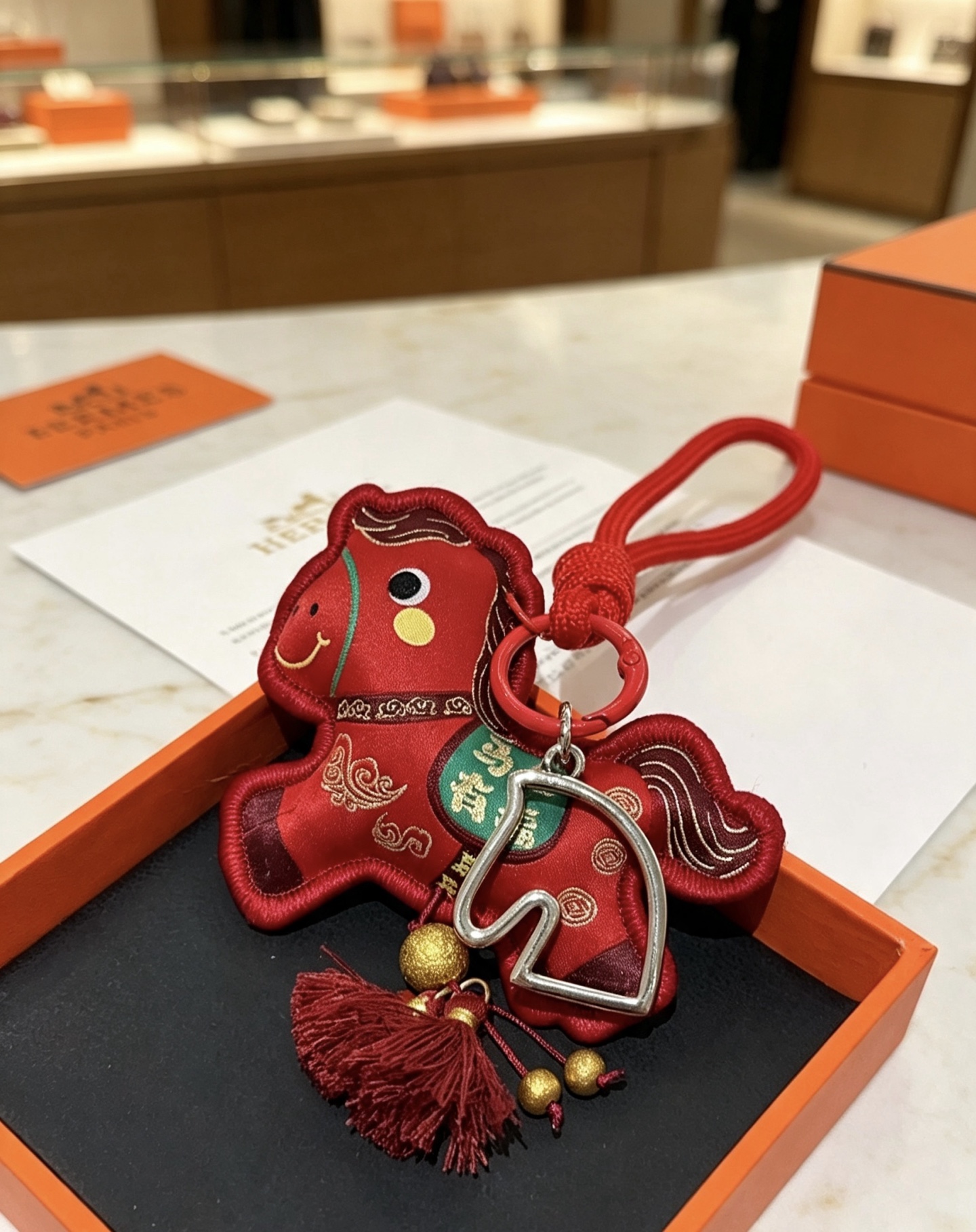 Hermes Horse Charm pendant Red fabric with silver-tone metal hardware gold decorative beads burgundy tassels green embroidered accent 12cm total length