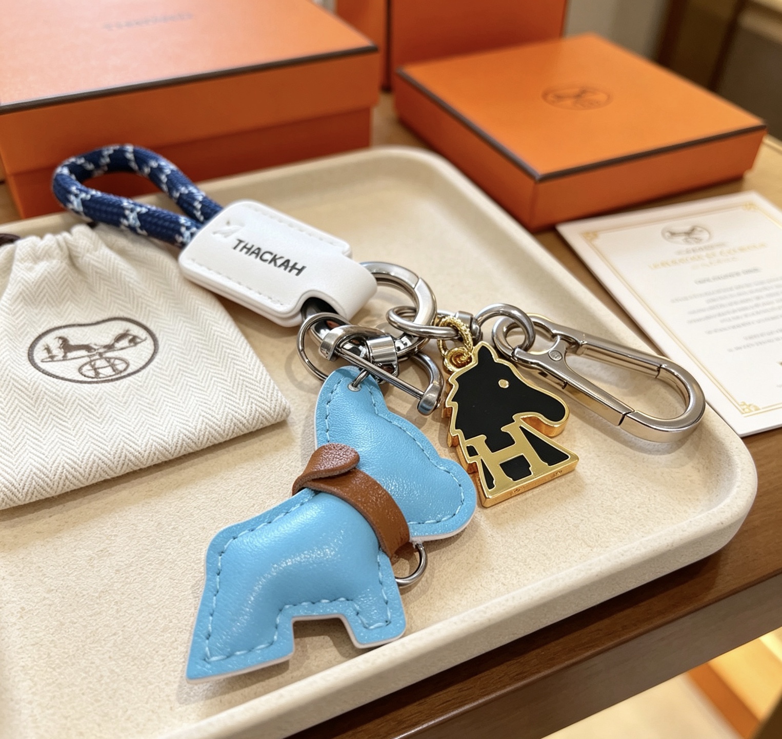 Hermes Cheval Horse Charm Keychain pendant Light blue leather brown leather white leather navy blue braided cord gunmetal hardware silver hardware gold-tone metal with black enamel 10cm total length