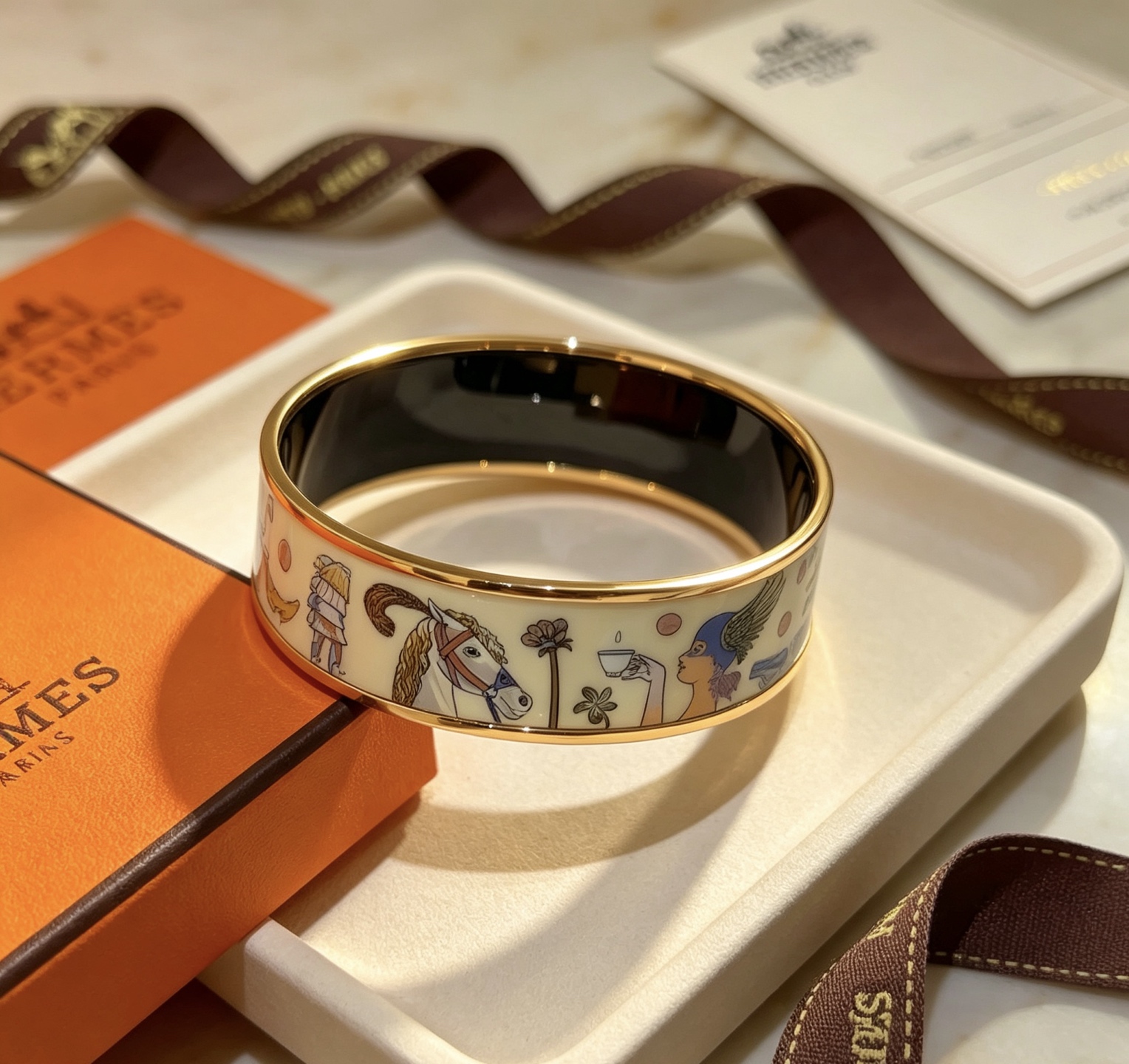 Hermes Clic Clac H Enamel Bangle bracelet Gold plated metal cream enamel with multicolor whimsical print black enamel interior 20mm width