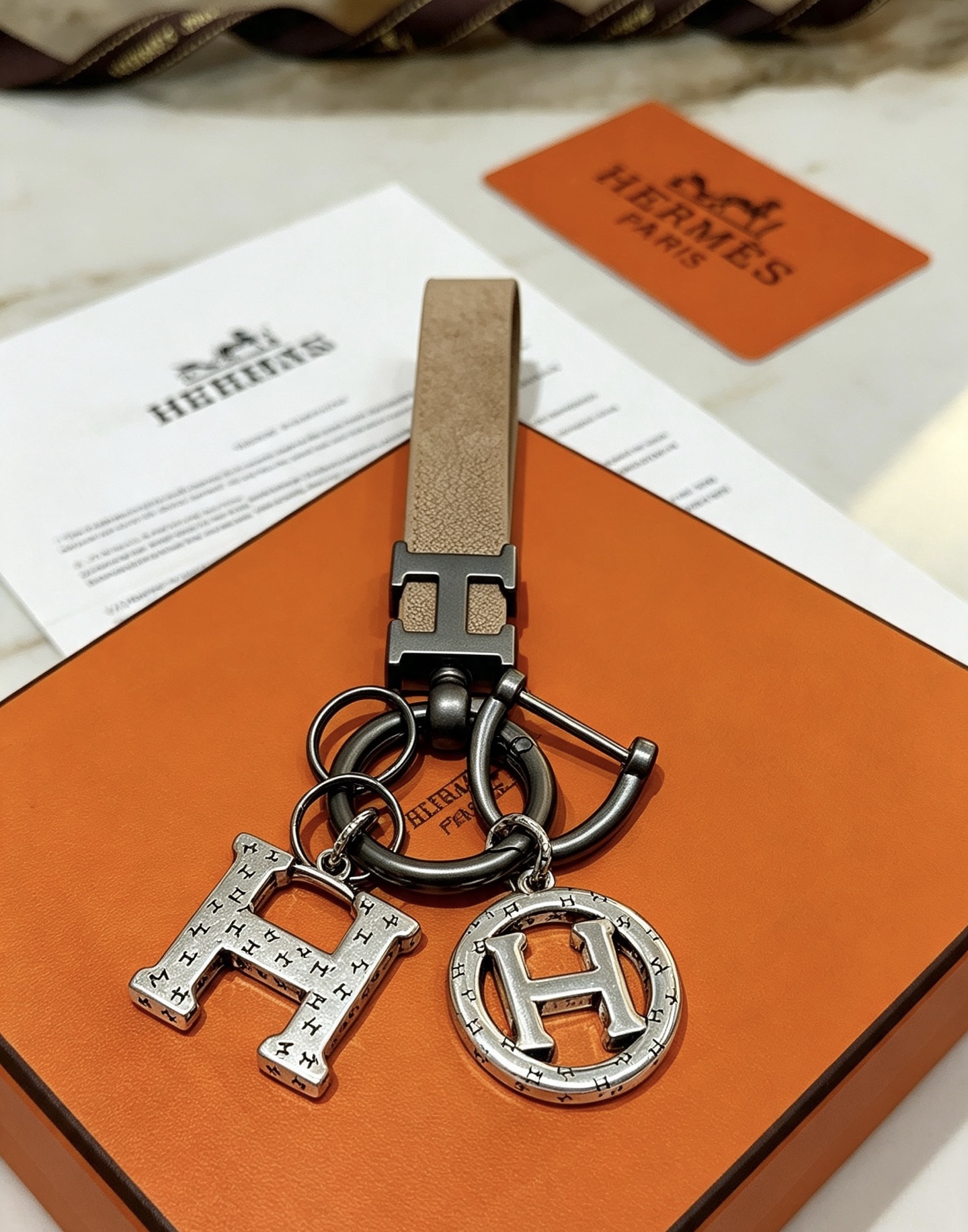 Hermes H Logo Charm Keychain pendant Etoupe taupe leather gunmetal silver-tone metal 10cm total length