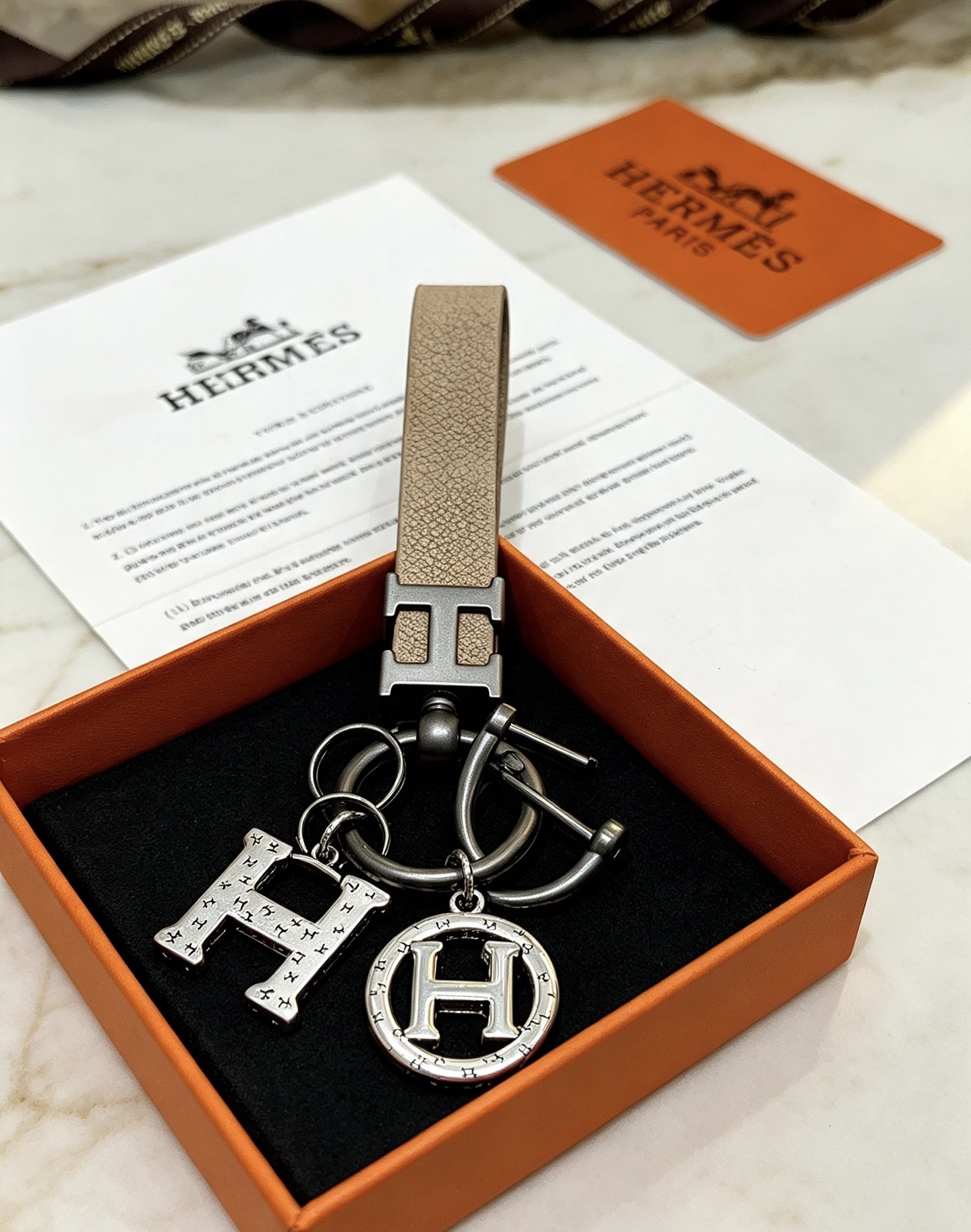 Hermes H Logo Charm Keychain pendant Etoupe taupe leather gunmetal silver-tone metal 10cm total length