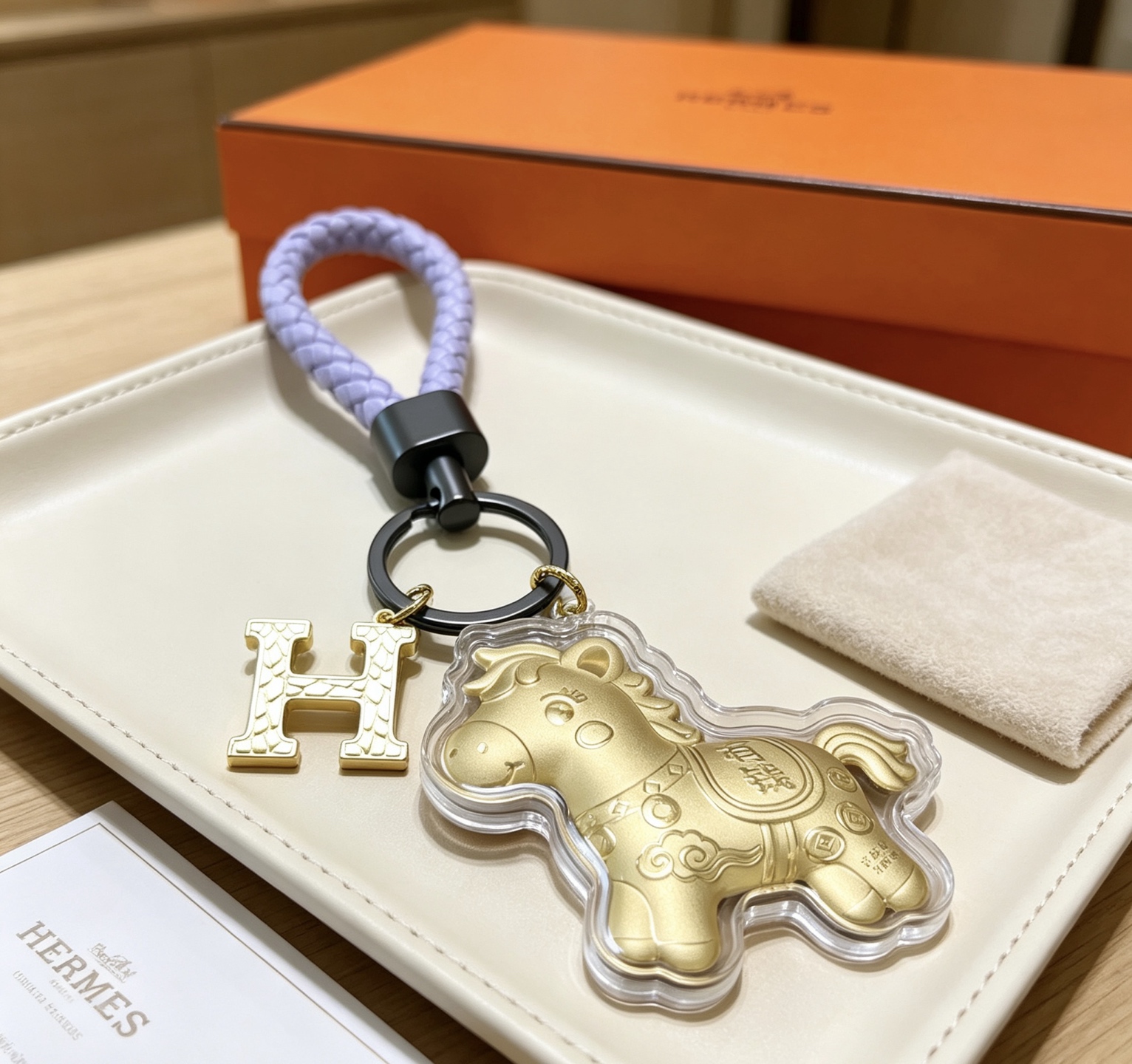 Hermes H Logo Lucky Horse Charm Keychain pendant matte gold metal lavender braided leather gunmetal hardware clear protective casing 12cm total length