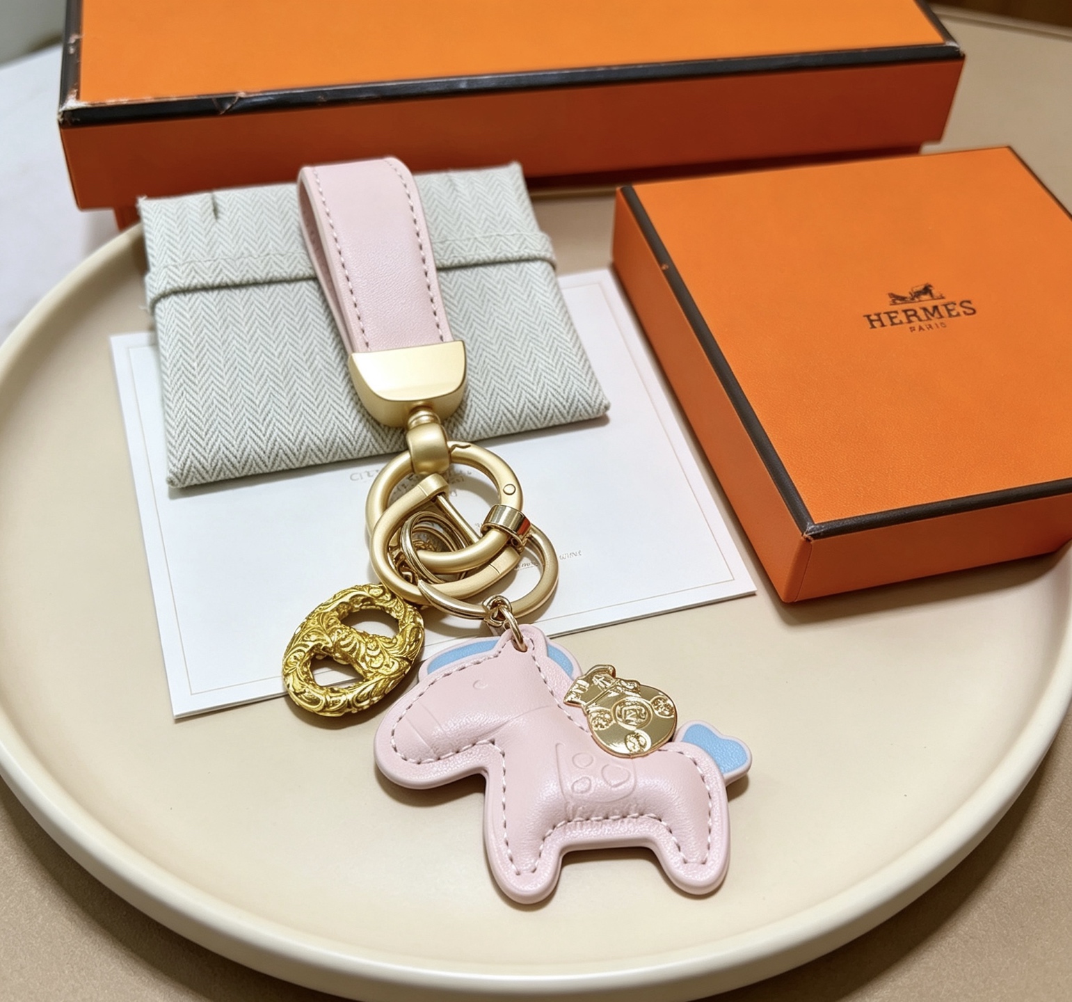 Hermes Rodeo Pony Key Charm pendant Light pink leather with light blue accents gold-tone metal hardware 12cm total length