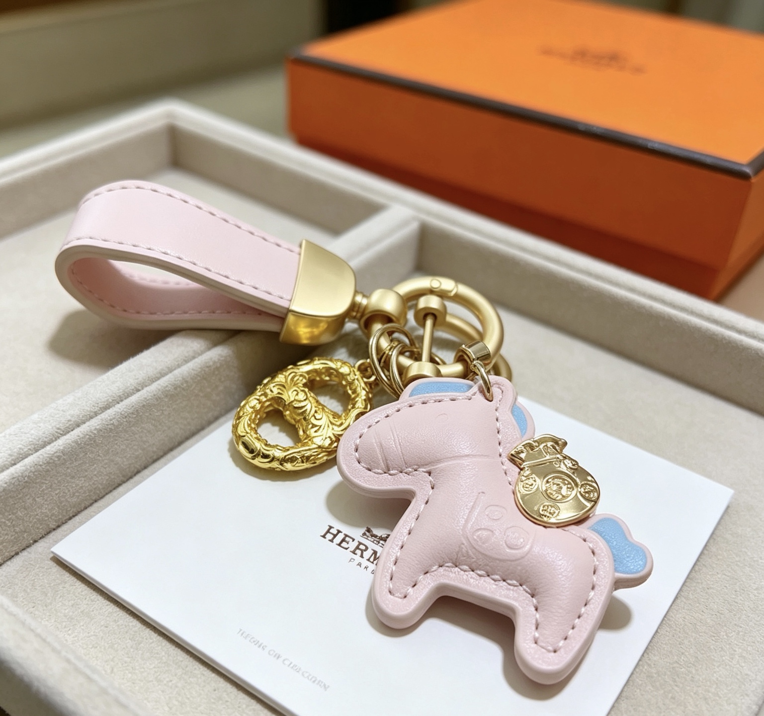 Hermes Rodeo Pony Key Charm pendant Light pink leather with light blue accents gold-tone metal hardware 12cm total length