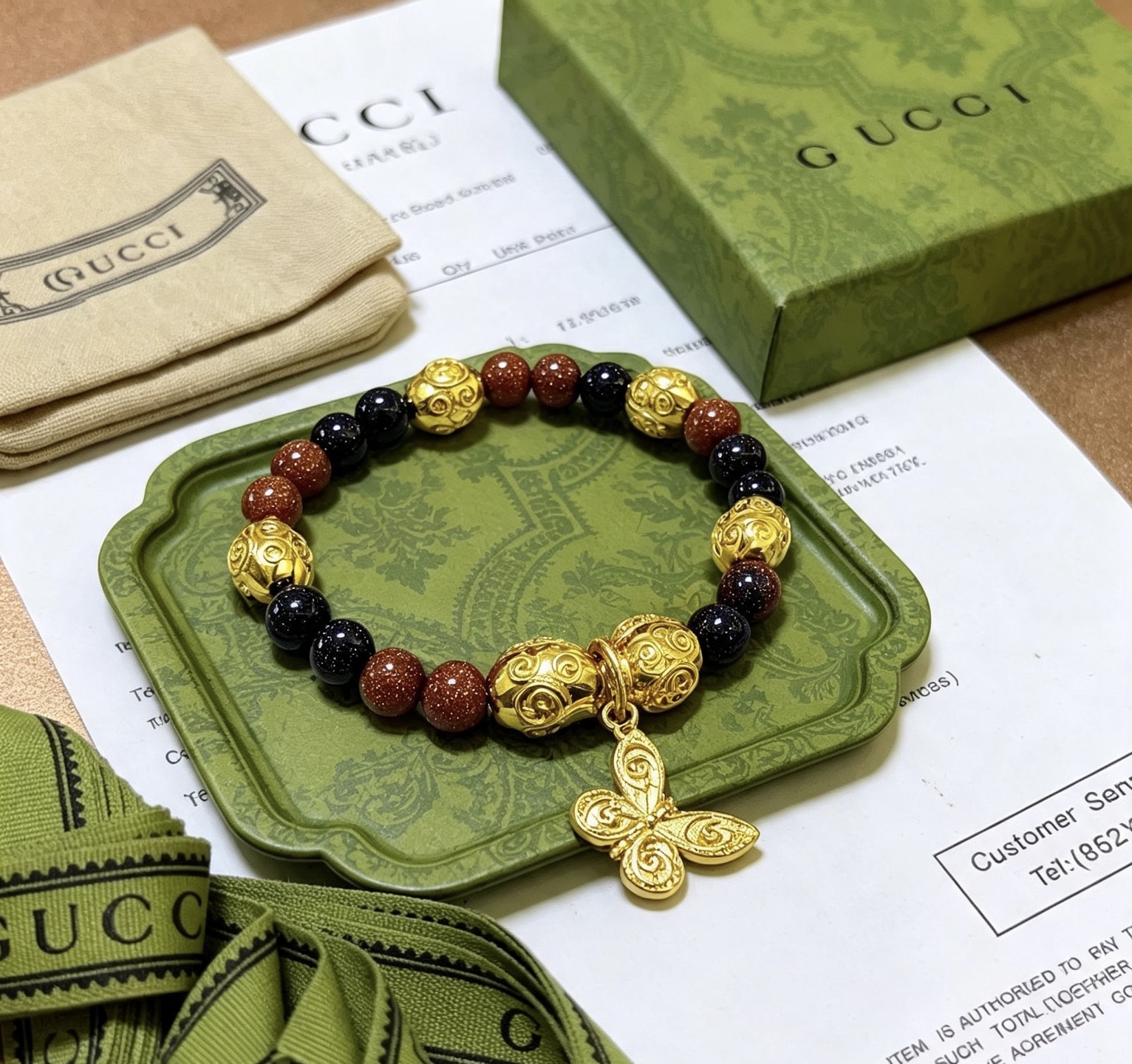 Gucci Anger Forest Butterfly Beaded Bracelet bracelet Gold-tone metal red goldstone beads black obsidian beads 18cm