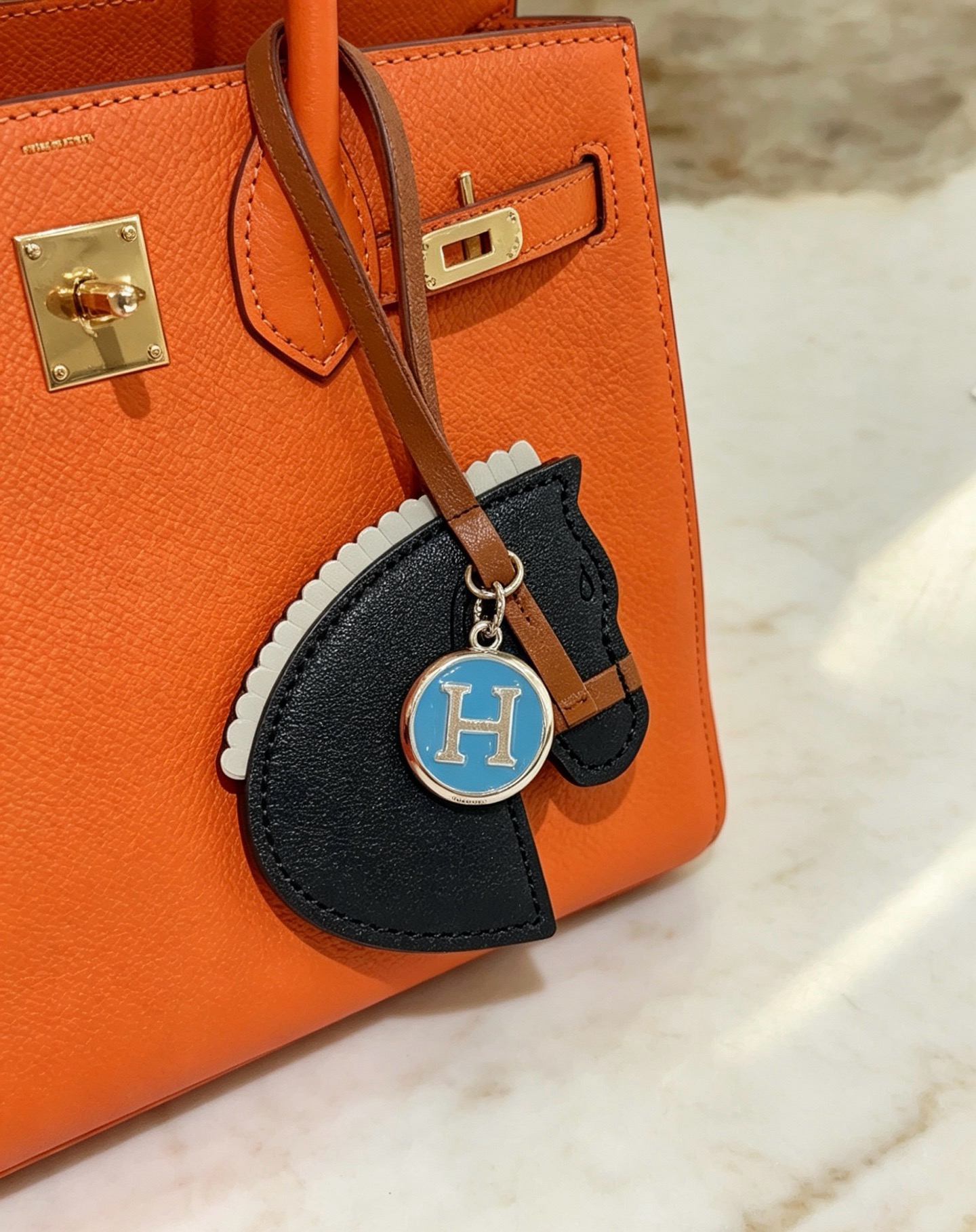 Hermes Cheval Horse Head Bag Charm with H Logo Medallion pendant Black tan light gray leather with silver-tone metal and blue enamel H logo 12cm leather strap length