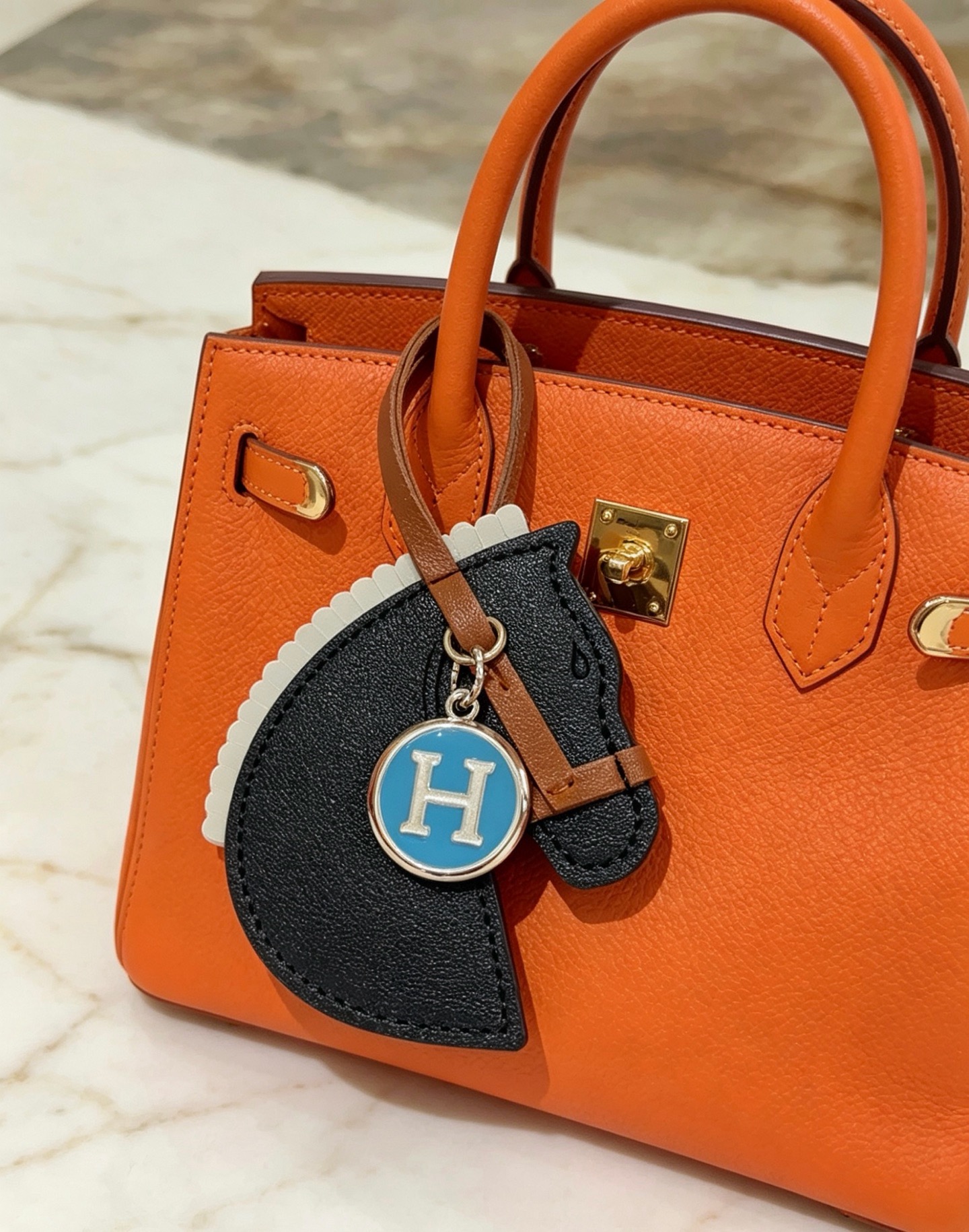 Hermes Cheval Horse Head Bag Charm with H Logo Medallion pendant Black tan light gray leather with silver-tone metal and blue enamel H logo 12cm leather strap length