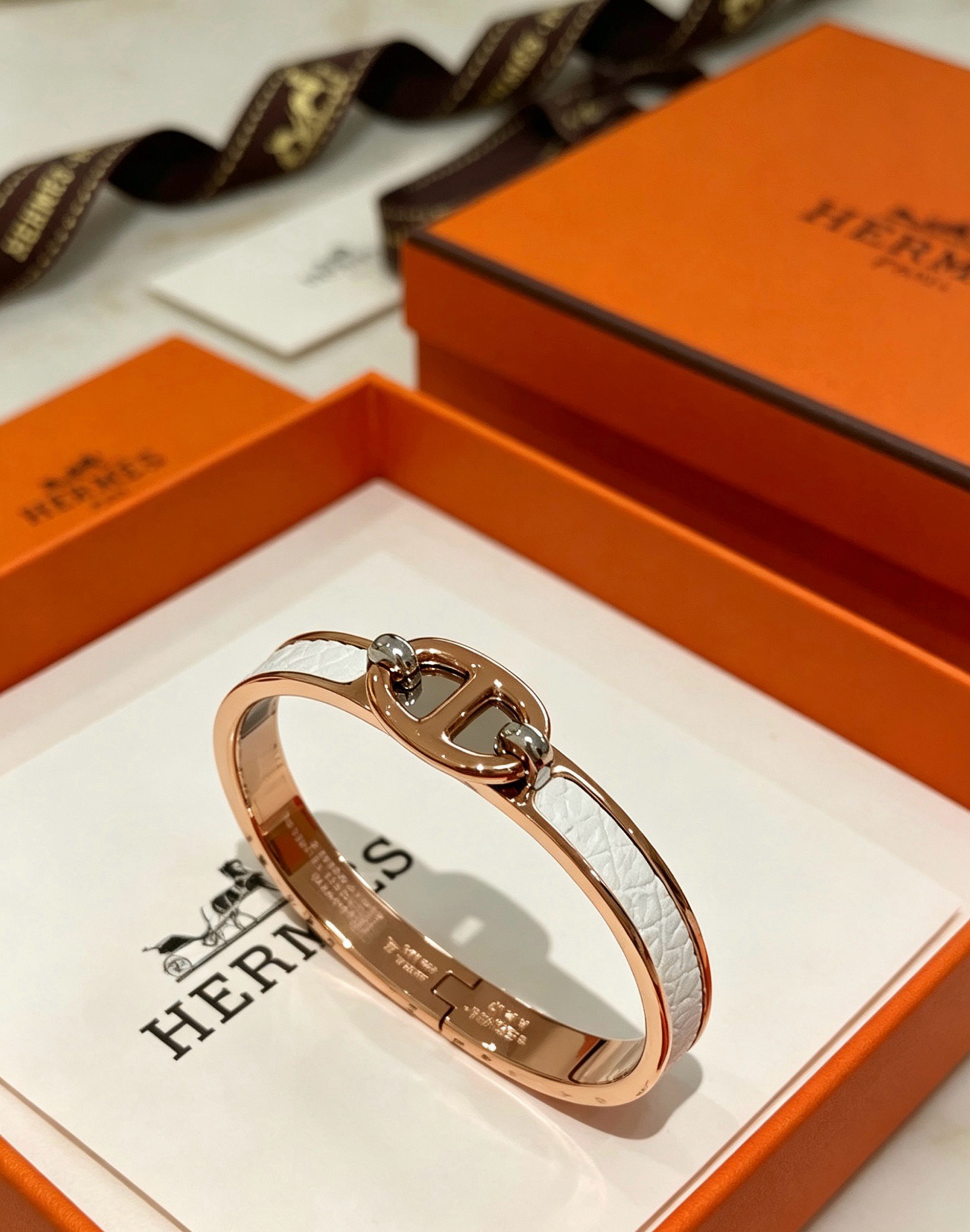 Hermes Clic Chaine d Ancre bracelet Rose gold metal with white embossed leather inlay silver-toned hardware accents 17cm