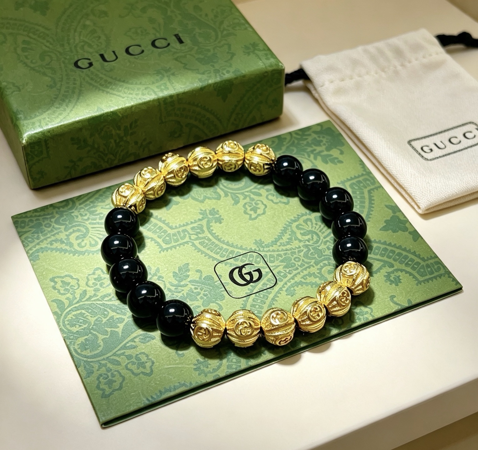 Gucci Anger Forest bracelet gold-tone metal with black onyx beads 18cm