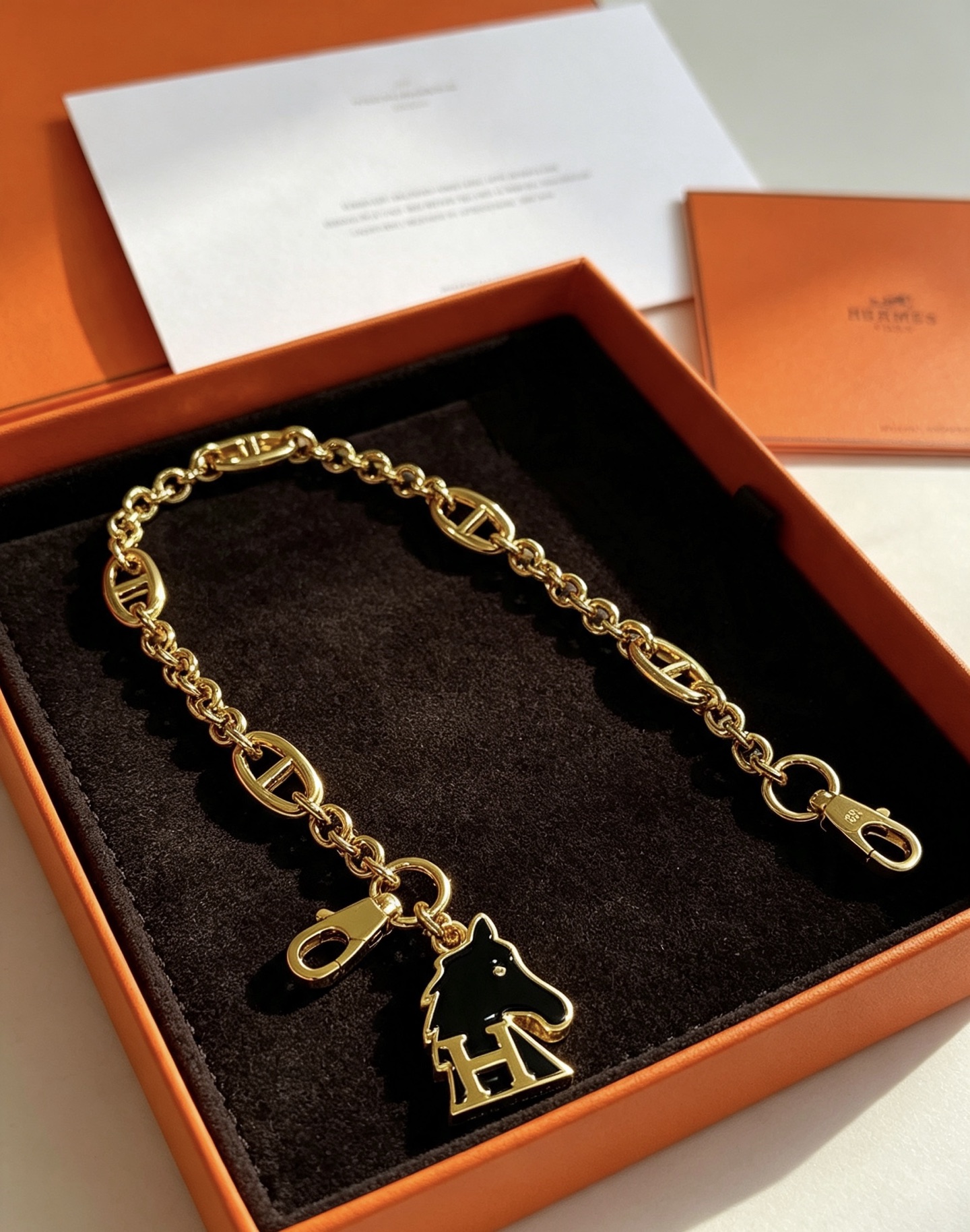 Hermes Cheval H Bag Charm Chain pendant gold-tone metal with black enamel 16cm chain length