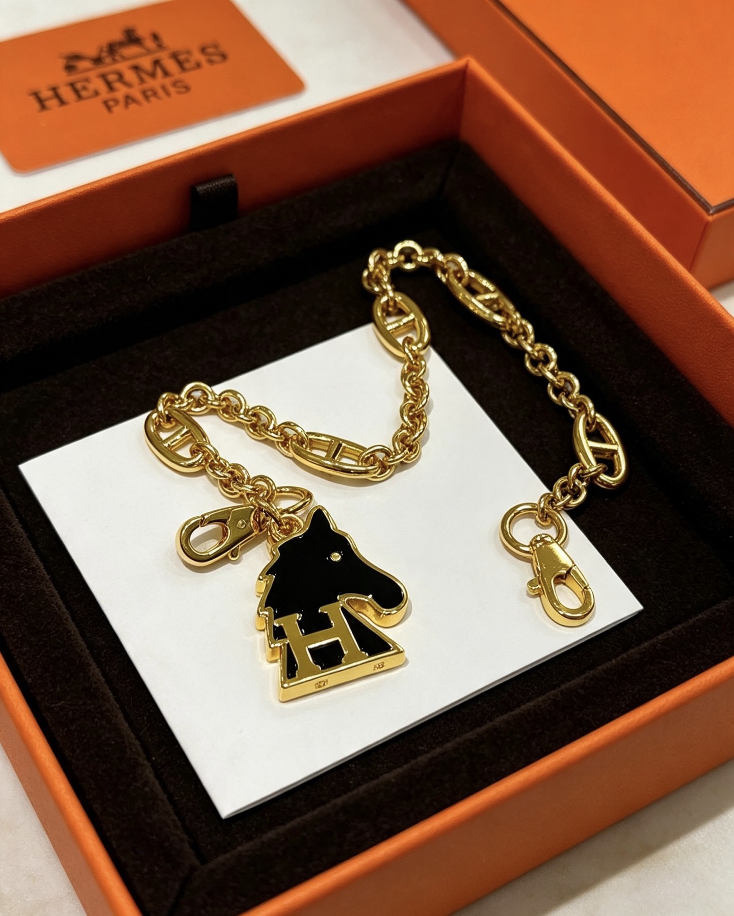 Hermes Cheval H Bag Charm Chain pendant gold-tone metal with black enamel 16cm chain length