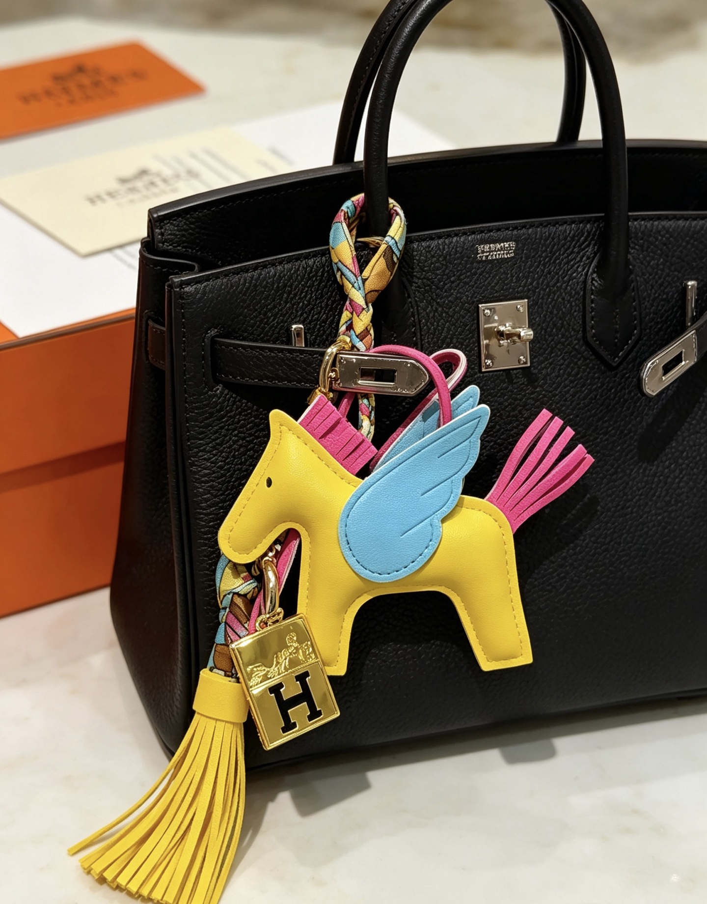 Hermes Rodeo Pegase Charm pendant Yellow lambskin with light blue wings fuchsia mane tail gold-tone H logo hardware multicolor silk twilly accent yellow leather tassel 8cm