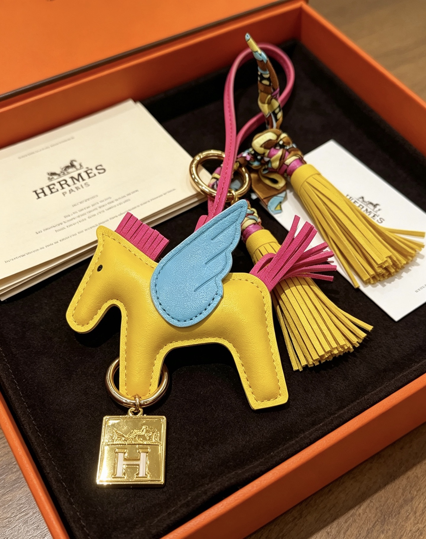 Hermes Rodeo Pegase Charm pendant Yellow lambskin with light blue wings fuchsia mane tail gold-tone H logo hardware multicolor silk twilly accent yellow leather tassel 8cm