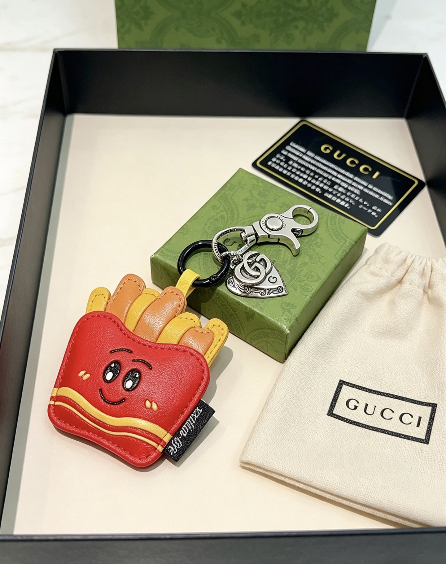 Gucci Anger Forest Cartoon French Fries Bag Charm Keychain pendant Silver-toned metal hardware red leather fries container yellow and orange leather fries black enamel facial details yellow accent stripes Total length 9cm charm height 6cm