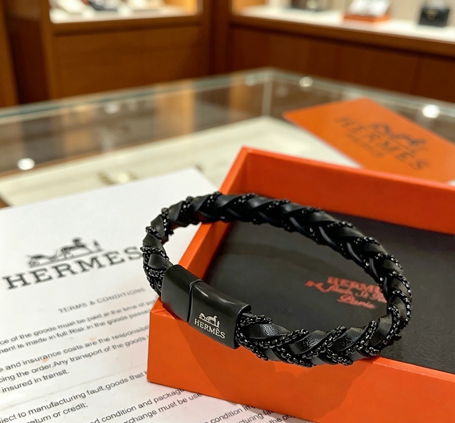 Pulseira de couro trançado Hermes Goliath Couro preto com ferragens de metal preto fosco e detalhes de corrente preta 19 cm