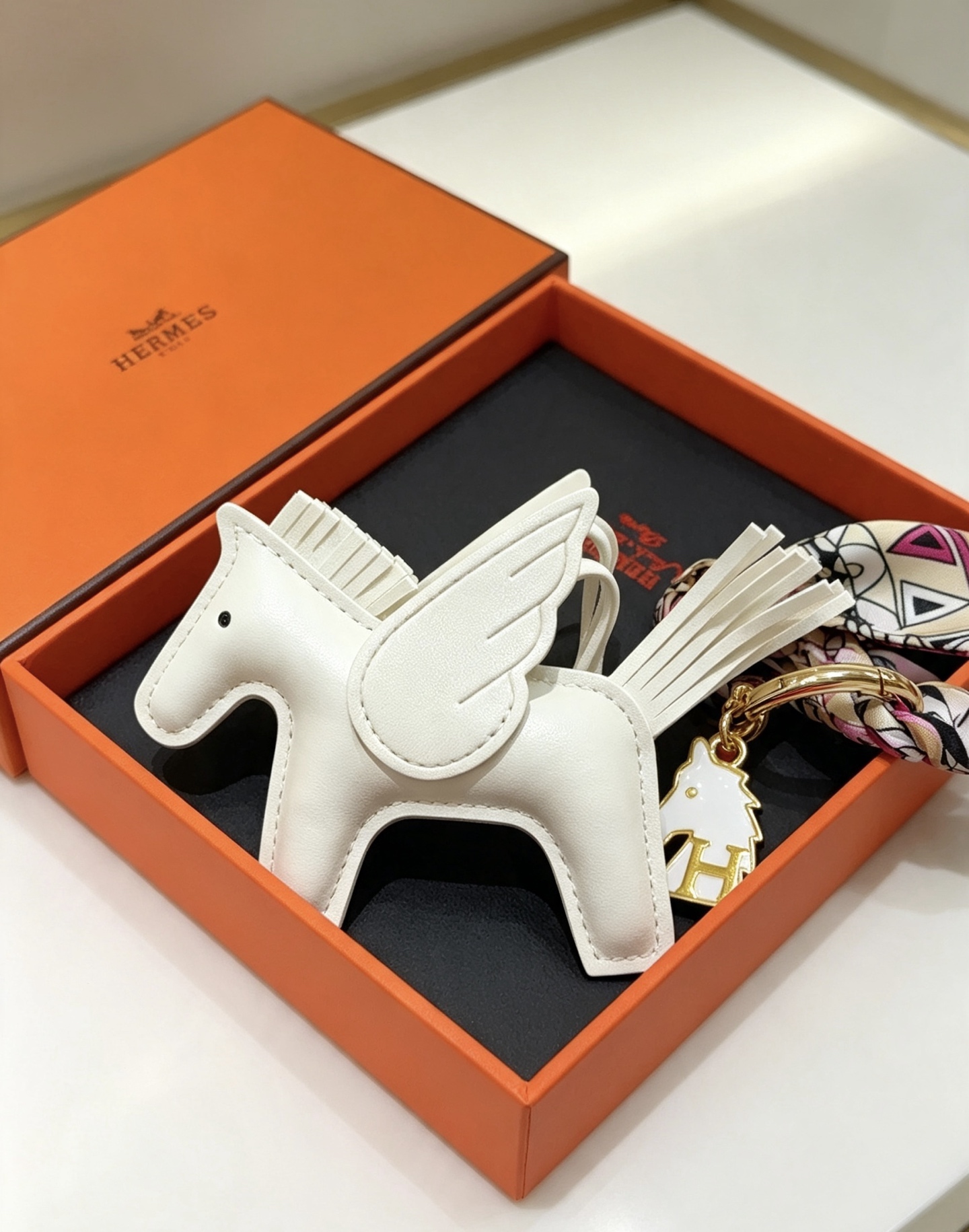 Hermes Rodeo Pegase Key Charm pendant White leather with gold tone metal multicolor printed silk twilly 12cm