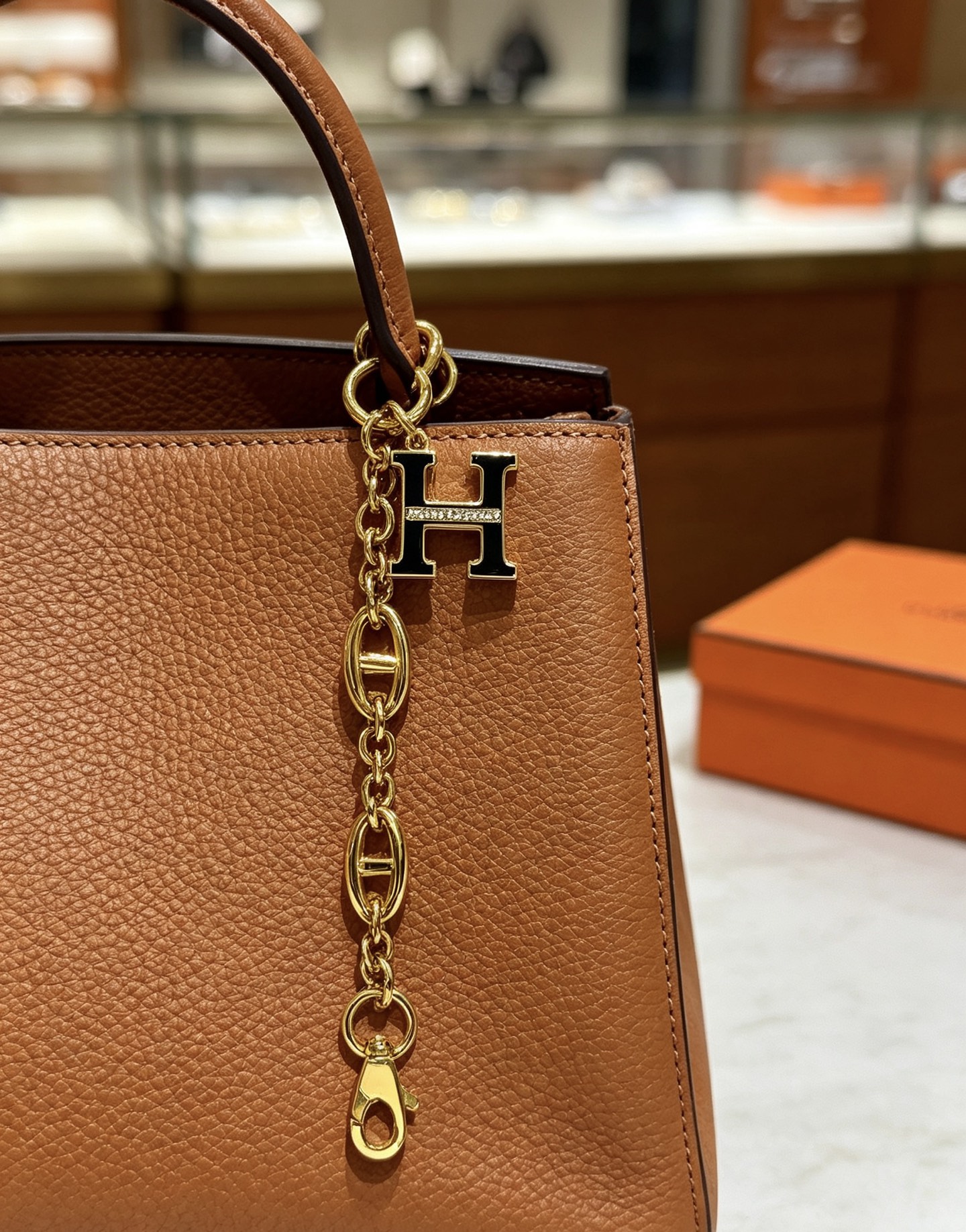 Hermes H Logo Chaine d Ancre Bag Charm Keychain pendant Gold-tone metal with black enamel and clear crystal accents 16cm
