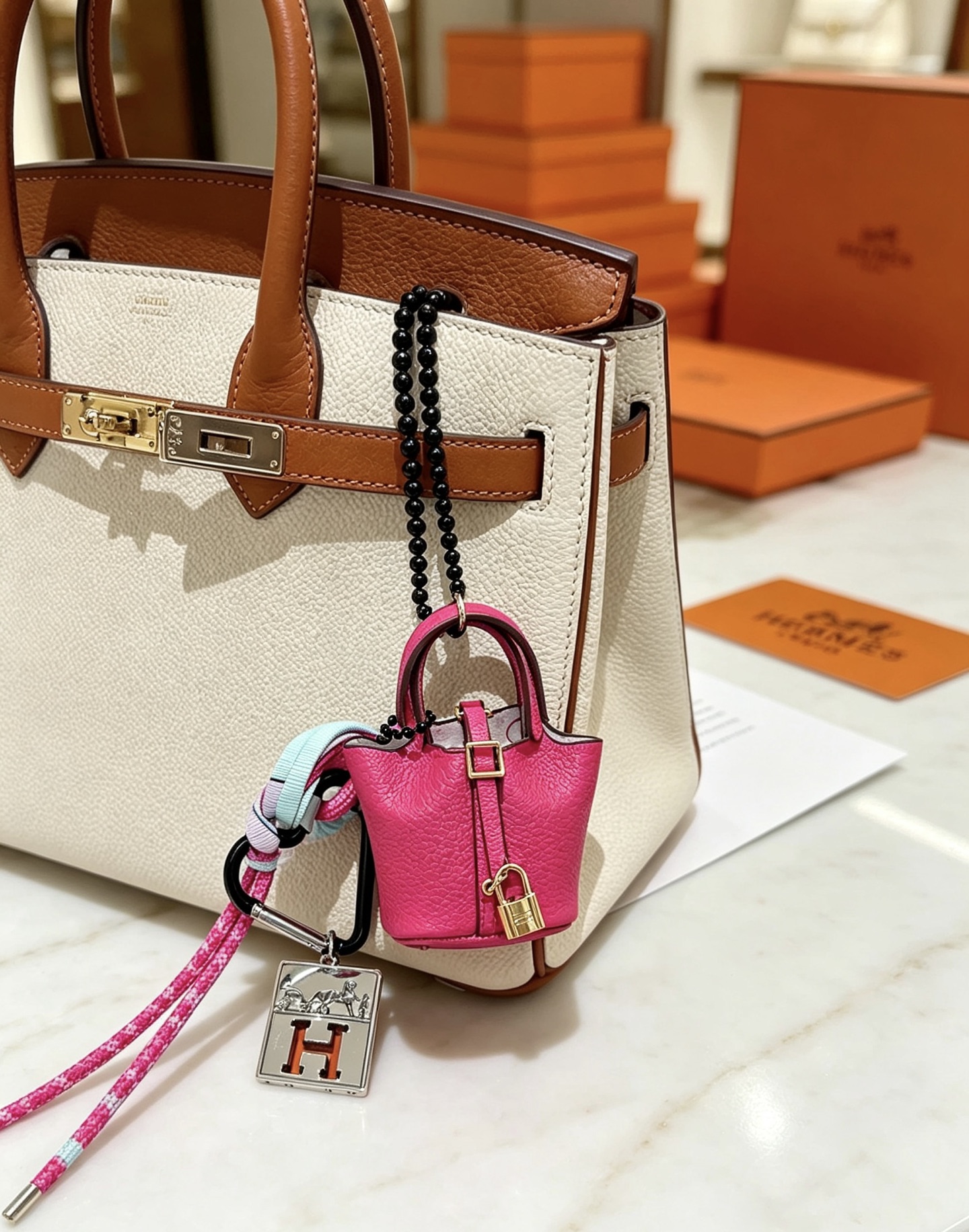 Hermes Mini Picotin Bag Charm with H Logo Tag pendant Hot pink grained leather with gold-tone hardware silver-tone H logo tag black carabiner multicolor braided strap black beaded chain Total length 12cm