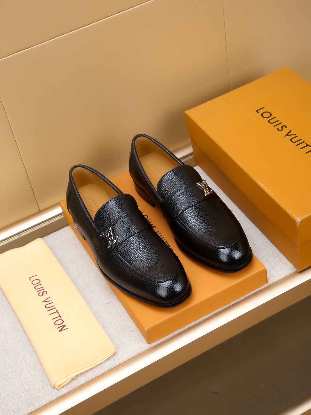 Louis Vuitton Men's Black Leather Loafers with Embossed Upper and Metal Logo