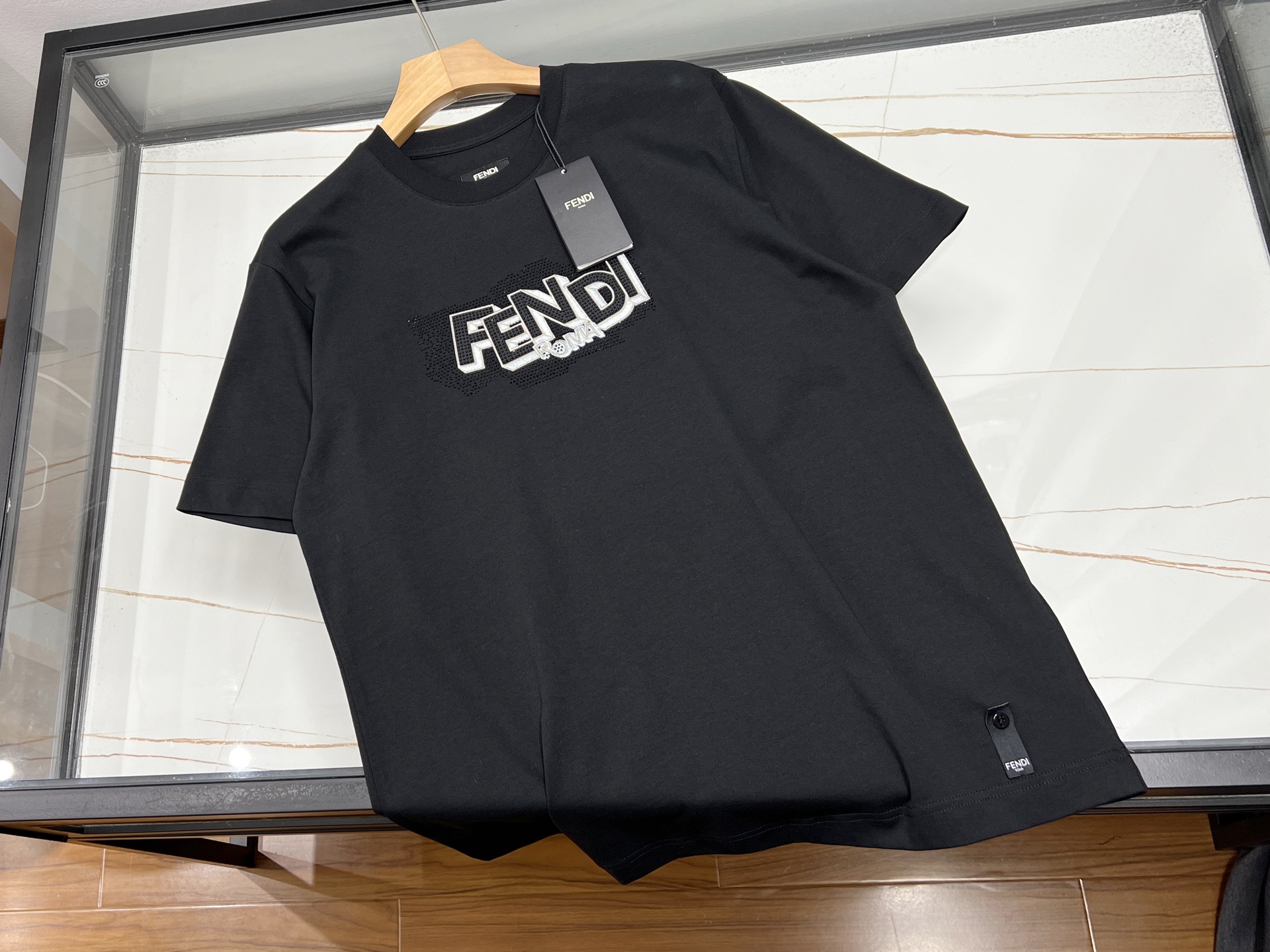 NO:700875,——The collision of fashion and personality in the hot brick letter short-sleeves. This hot brick letter short-sleeve is undoubtedly a dazzling presence in the fashion world. The selected high-quality fabrics are soft to the touch and skin-friendly, and have excellent breathability. Even in the hot summer, it can keep you fresh and comfortable at all times.  Its uniqueness lies in the carefully designed hot brick letters on the chest. Each brick has been finely polished and shines brightly under the light, instantly becoming the visual focus. The letters are unique in shape, either unruly or playful, adding individual charm to the overall shape.  Whether paired with simple jeans to show casualness; or paired with a fashionable short skirt to highlight youthful vitality, it can be easily controlled. Put on this hot brick letter short-sleeve, you will be the most dazzling presence on the street, and let go of your own fashion attitude. Available in stock in two colors S-XL, Fendi-clothing, fendi, skirts, jeans, T-shirt,19860909——烫砖字母短袖时尚与个性的碰撞这件烫砖字母短袖,无疑是时尚界的亮眼存在.精选的优质面料,触感柔软亲肤,透气性极佳,即便在炎炎夏日,也能让你时刻保持清爽自在. 其独特之处在于胸前精心设计的烫砖字母.每一颗砖片都经过精细打磨,在光线下闪耀着璀璨光芒,瞬间成为视觉焦点.字母造型独特,或张扬不羁,或俏皮可爱,为整体造型增添了个性魅力. 无论是搭配简约的牛仔裤,展现休闲随性；还是配上时尚的短裙,凸显青春活力,它都能轻松驾驭.穿上这件烫砖字母短袖,你就是街头最耀眼的存在,尽情释放属于自己的时尚态度. 现货发售二色S-XL,芬迪-服装,fendi,skirts,jeans,T-shirt,,Women's clothing