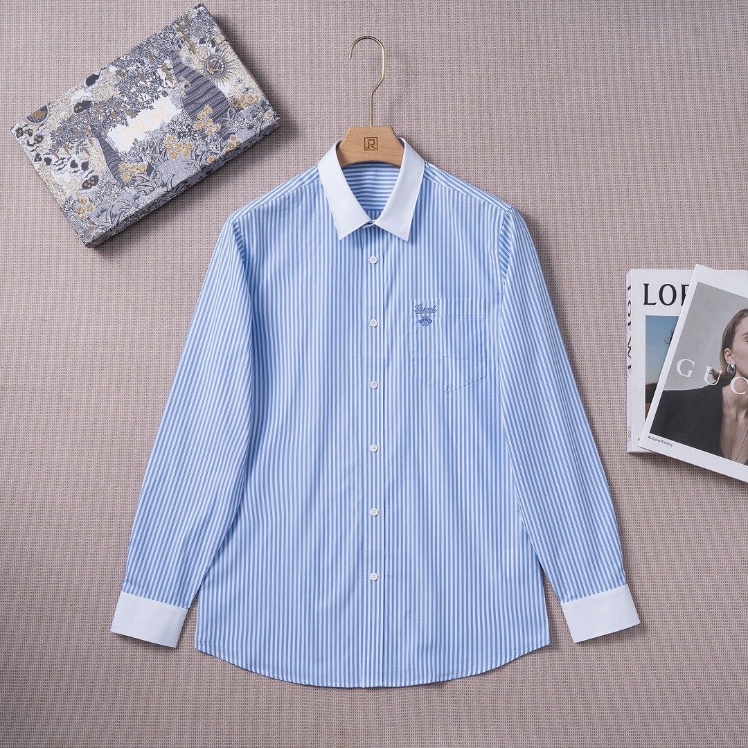 NO:118005,[New Products Launched] G Home 25 Spring and Summer Fashion Long Sleeve Shirt! The high-end fashion aesthetic design combines three-dimensional cut styles to make the wear more comfortable and ornamental. The top Swiss ALUMO Arum company selected 100 pure cotton woven fine striped fabrics, which have been processed without ironing. The fabric has a high texture and comfort, excellent gloss, excellent skin-friendliness and breathability, and the texture exudes a sense of luxury and gorgeousness! It uses German imported Kedobao lining cloth and luxury brand special lining cloth. Its function makes the collar and splicing area of ​​the shirt more flat, crisp and stylish. With the imported shaping machine shaping process, the entire shirt can be described as the 