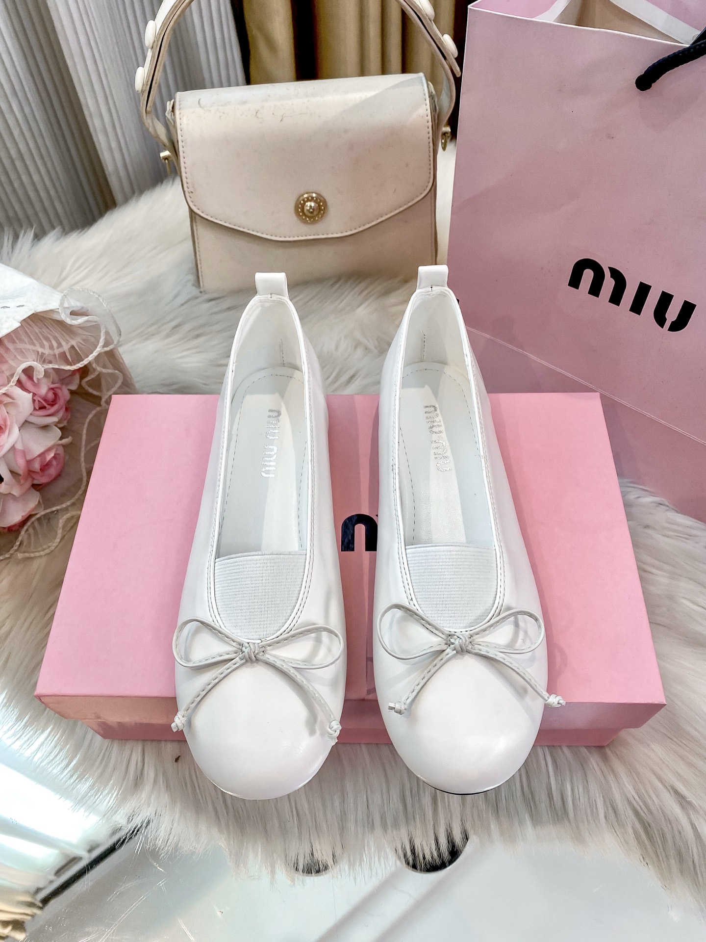 Miu Miu Women's Ballet Flats with Bow Detail - Classic Elegance