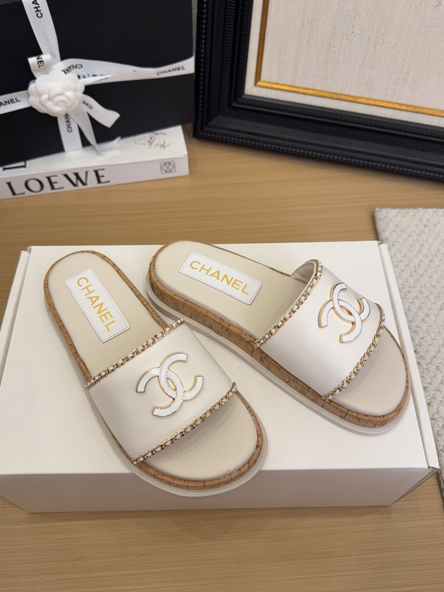 Elegant Chanel Women's White Leather Slides with CC Logo & Chain Detail 1 Elegant Chanel Women's White Leather Slides with CC Logo & Chain Detail