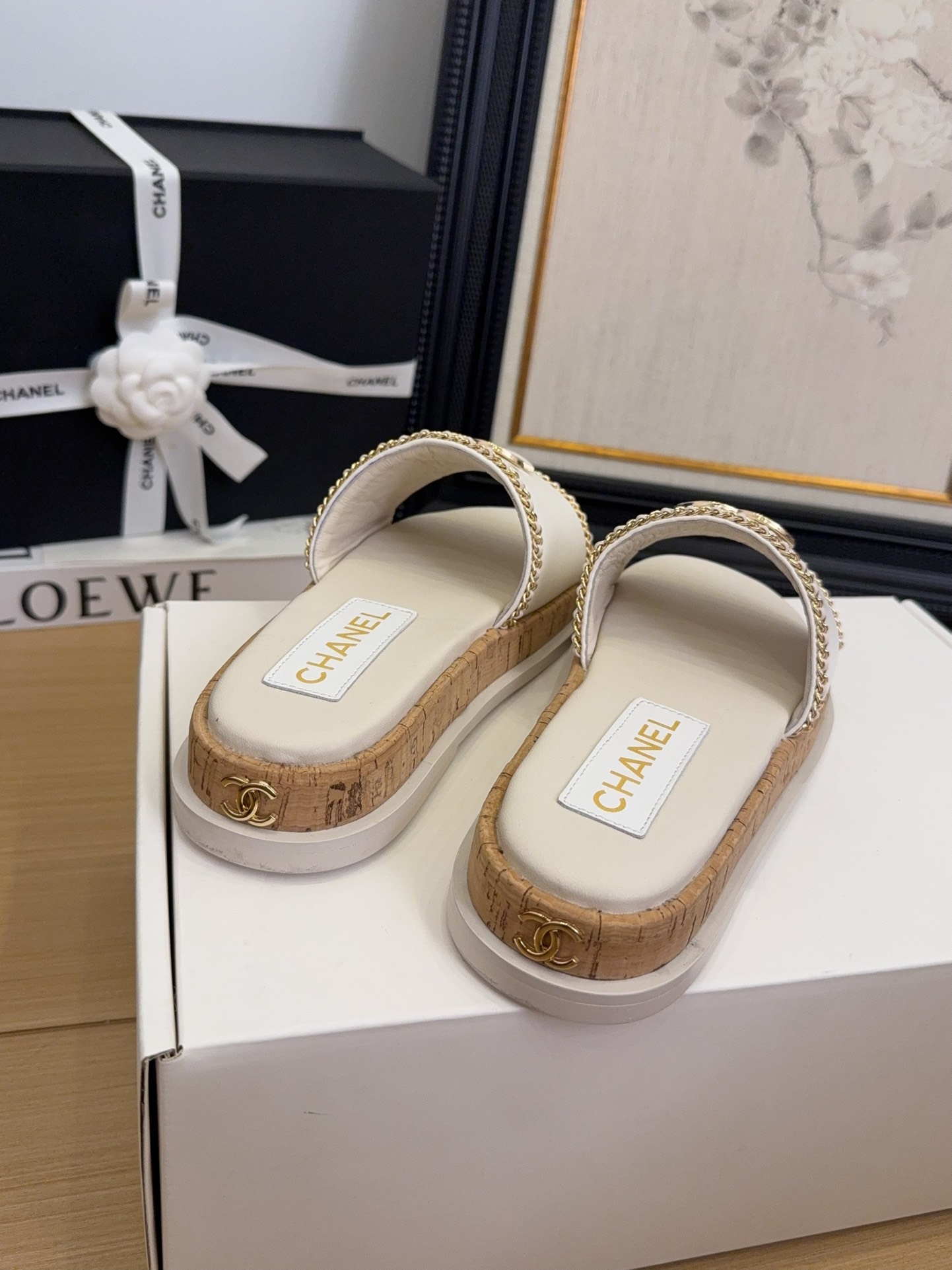 Elegant Chanel Women's White Leather Slides with CC Logo & Chain Detail 7 i1744209384 8170 6