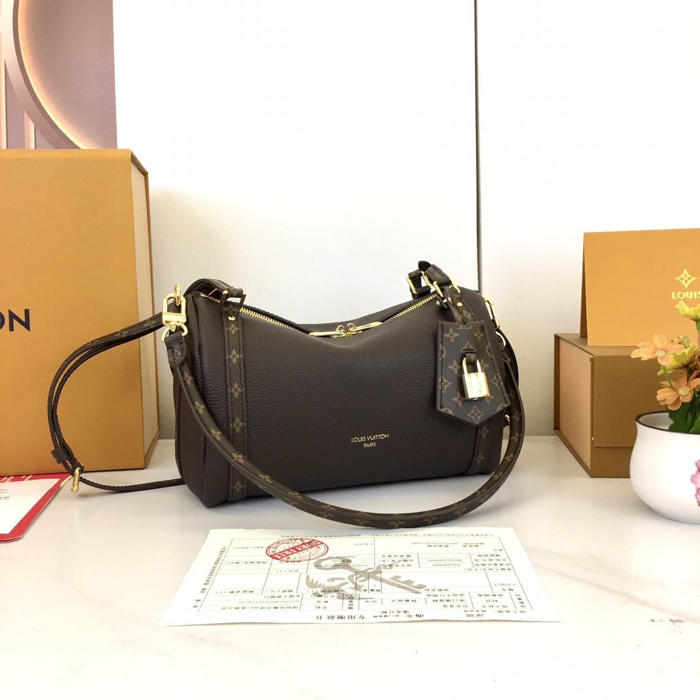 Louis Vuitton Express Small Handbag in Brown Leather with Monogram Trim 4 i1756318656930 7876 0 2