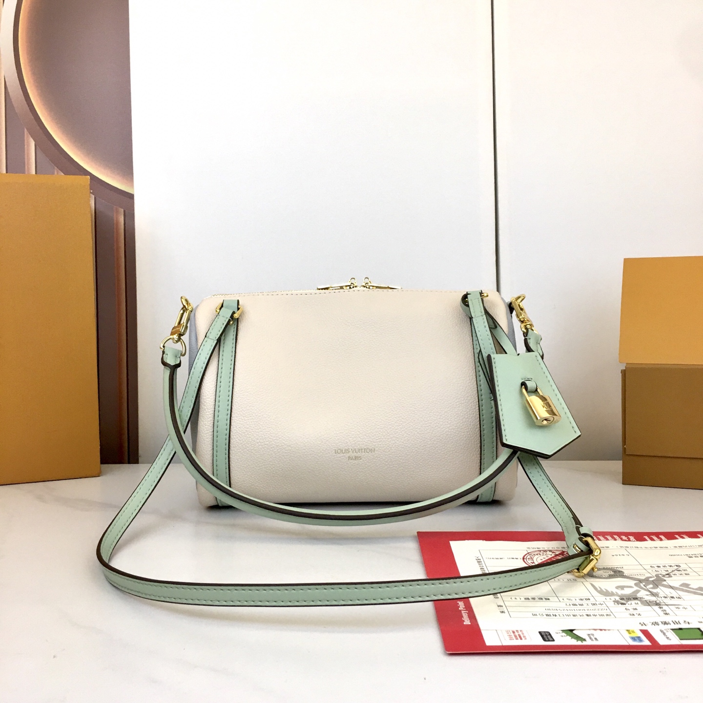 Louis Vuitton Express Small Handbag in White Leather with Mint Accents 3 i1758042577622 7840 0 1