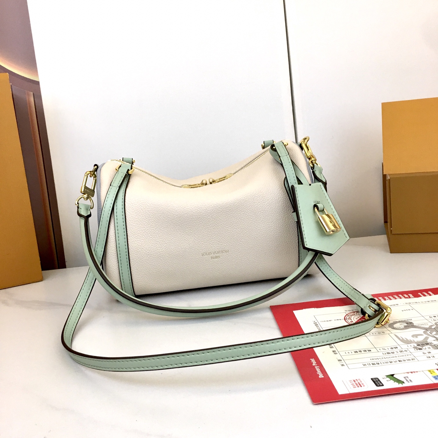 Louis Vuitton Express Small Handbag in White Leather with Mint Accents 4 i1758042577622 9538 0 2