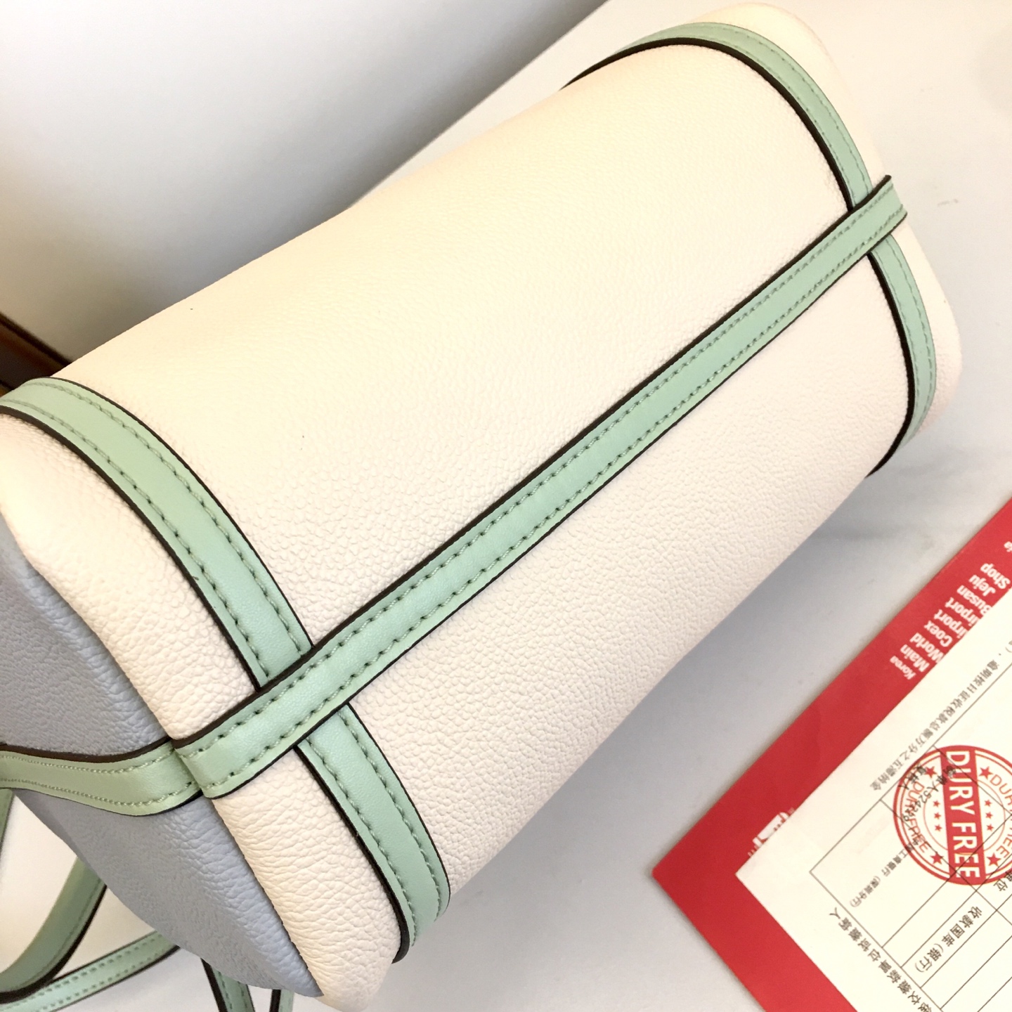 Louis Vuitton Express Small Handbag in White Leather with Mint Accents 6 i1758042582523 8871 0 4