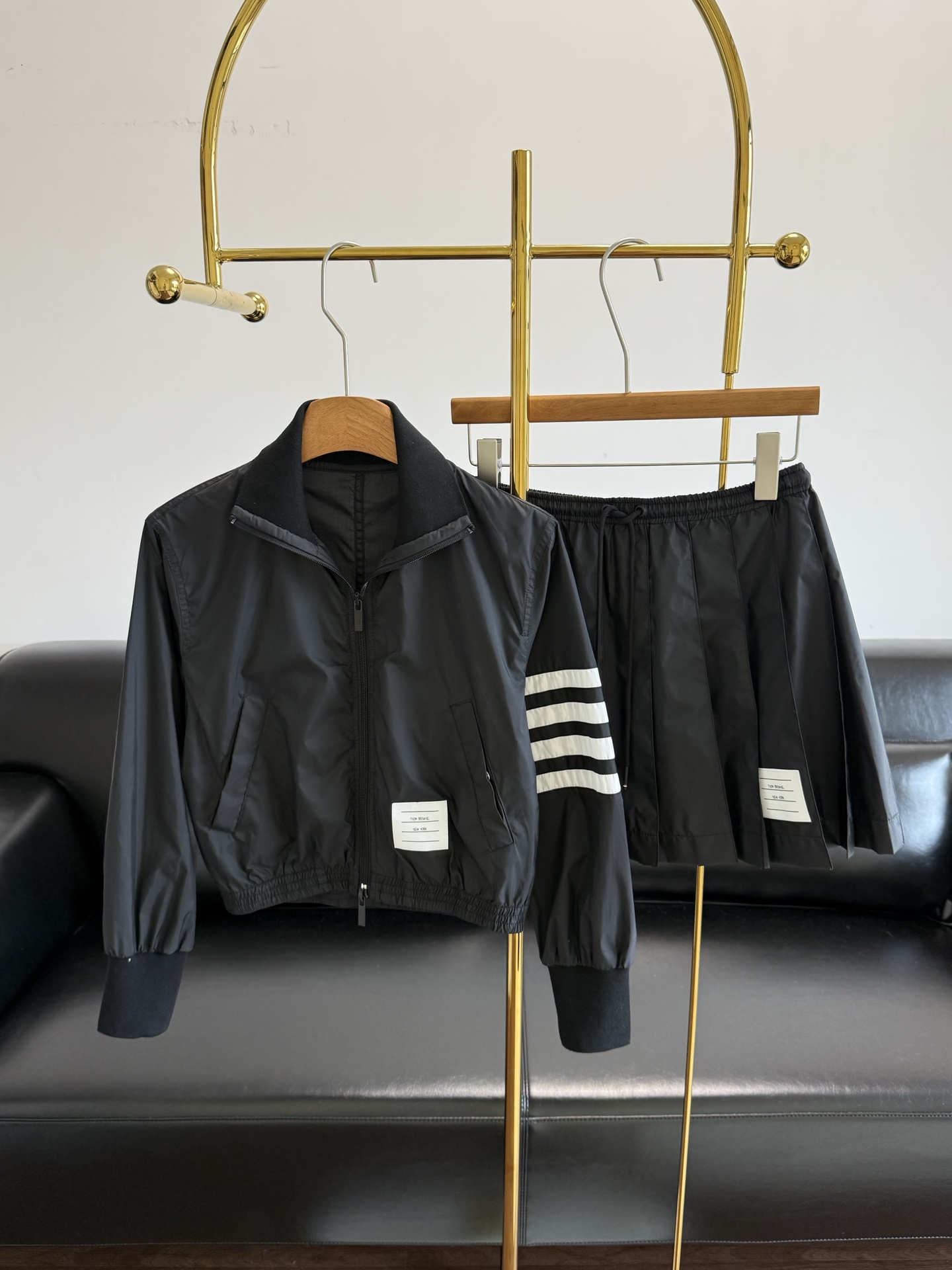 NO:841790,Jacket p short skirt Thom Browne same style nylon suit Jacket classic baseball design, four-bar stripes on the cuffs are very recognizable! Made of windproof nylon, very suitable for spring and autumn, drawstring cuffs are practical and fashionable. White label embellishment on the chest, simple and detailed. Black is versatile and looks great with skirts or sweatpants. It can easily switch between college style or sports style, and can be held in daily outings and light sports! Size sml Jackets Skirts, skirts, jackets &  coats,19860909外套 p短裙 Thom Browne同款尼龙套装 外套经典棒球服设计,袖口四杠条纹超有辨识度!防风尼龙材质,春秋穿超合适,抽绳袖口实用又时髦.胸前白色标签点缀,简约又有细节感.黑色百搭,随便配裙装或运动裤都很出彩,轻松切换学院风or运动风,日常出街,轻运动都能hold住! 码数sml 外套 短裙,,skirts,jackets & coats,,Women's clothing
