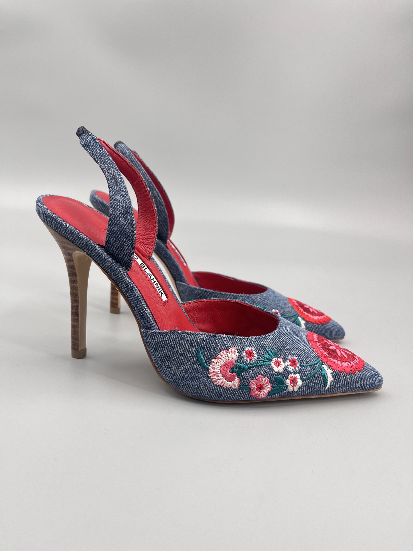 Manolo Blahnik’s Hand-Sewn Flower Embroidered Cowboy Heel Sandals: A Classic Collection.
