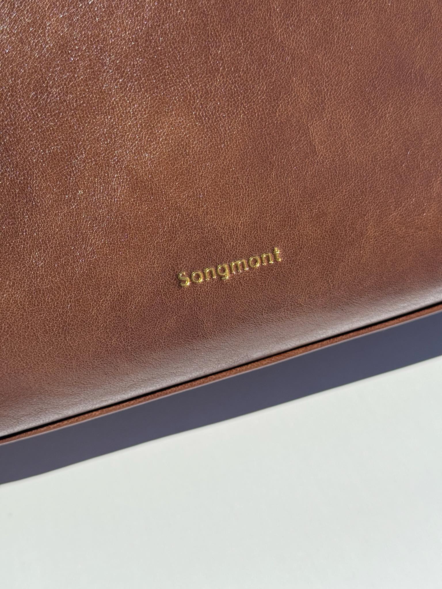 The exterior features the signature hardware attachment ring to - Comprehensive
