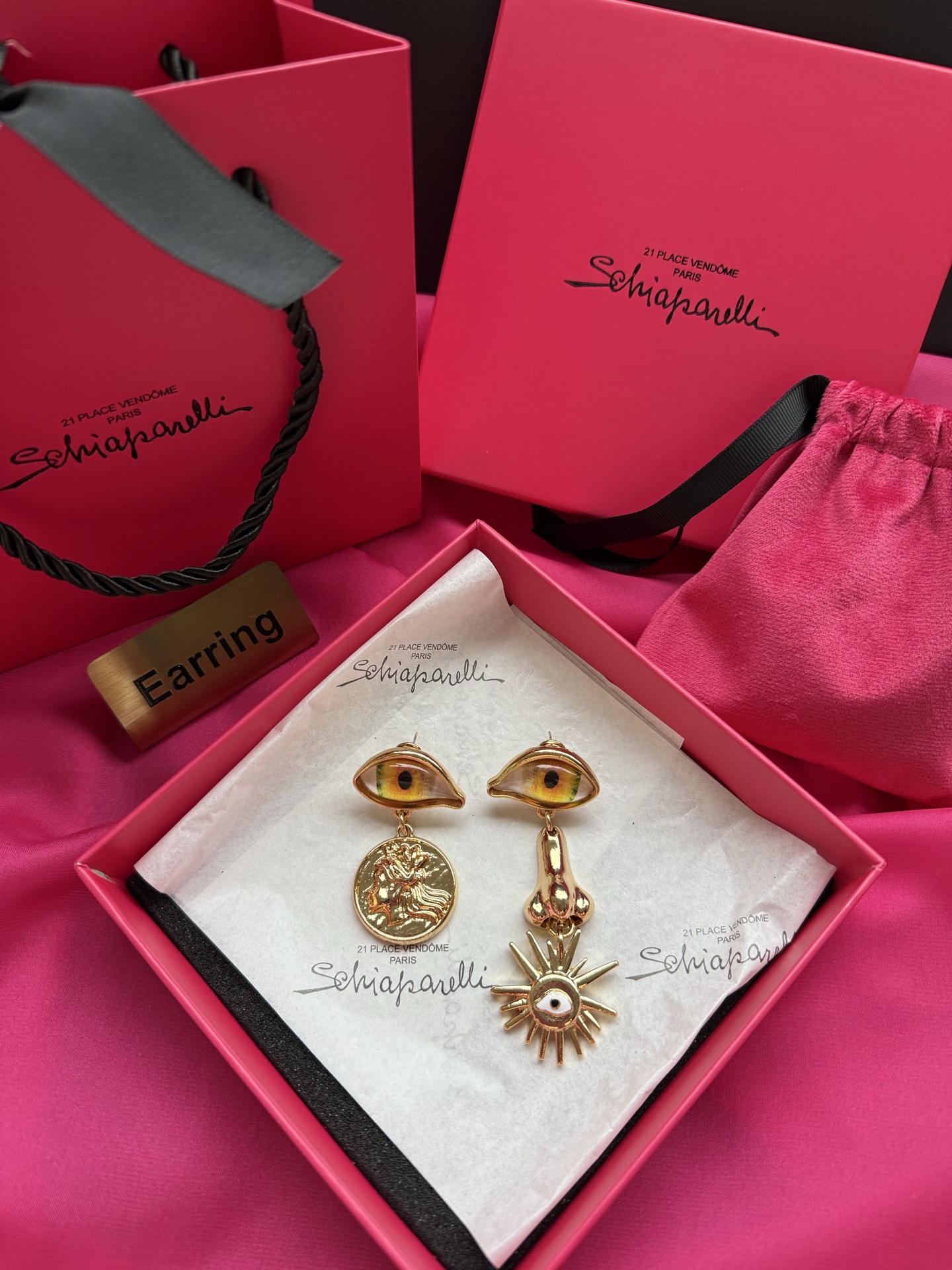 Серьги Schiaparelli с глазами и солнцем