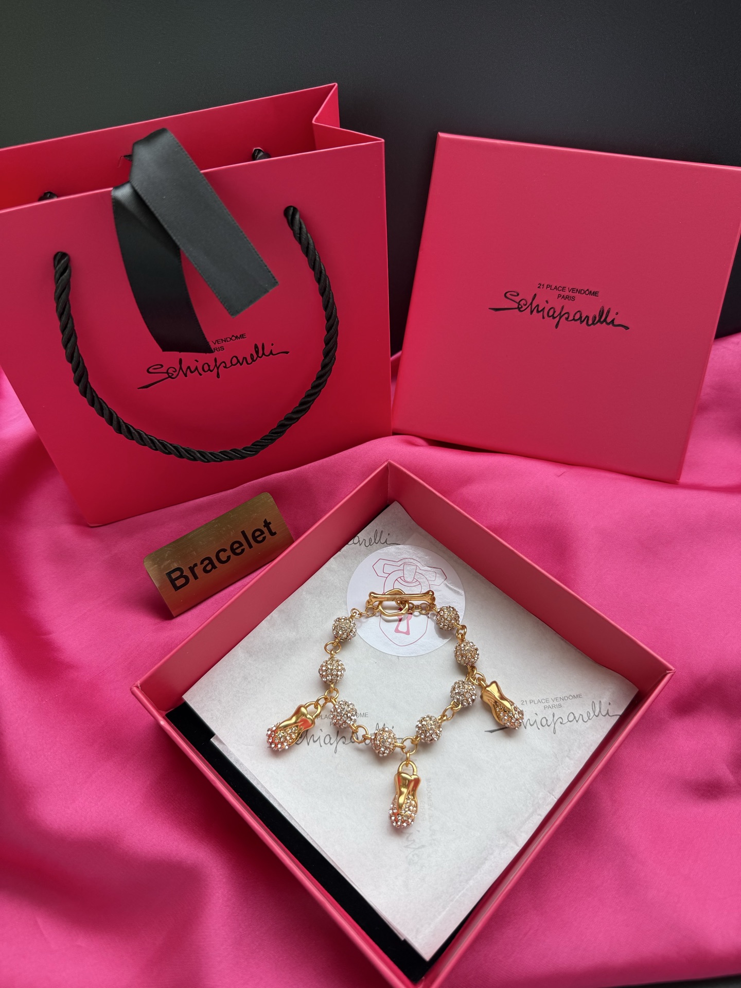 Браслет с кисточками и подвесками Schiaparelli