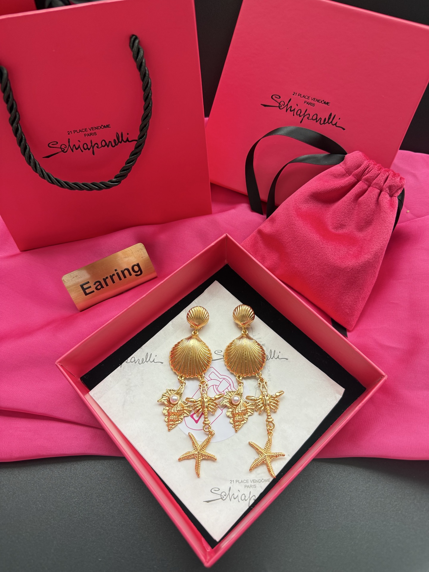 Золотистые серьги с морскими мотивами Schiaparelli