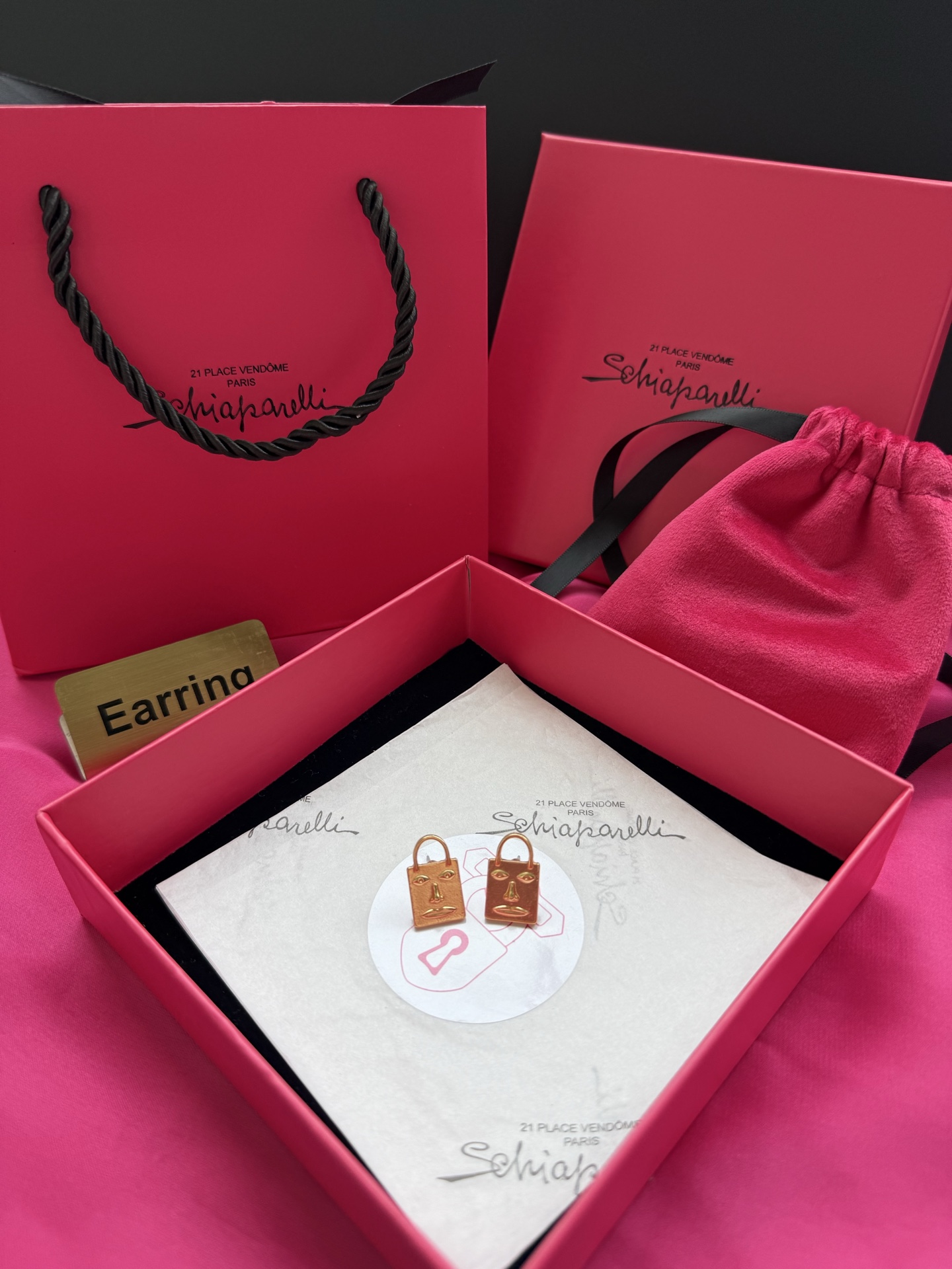Серьги в форме лица Schiaparelli