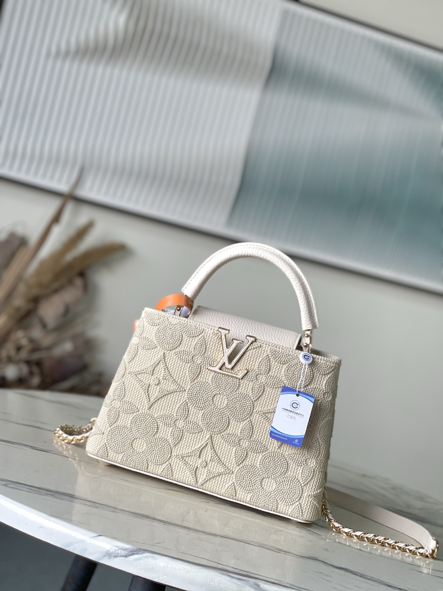 特级原厂皮 M14389 小号 这款时尚的Cacines属于“花园动画”系列，灵感源自新艺术风格的图案。