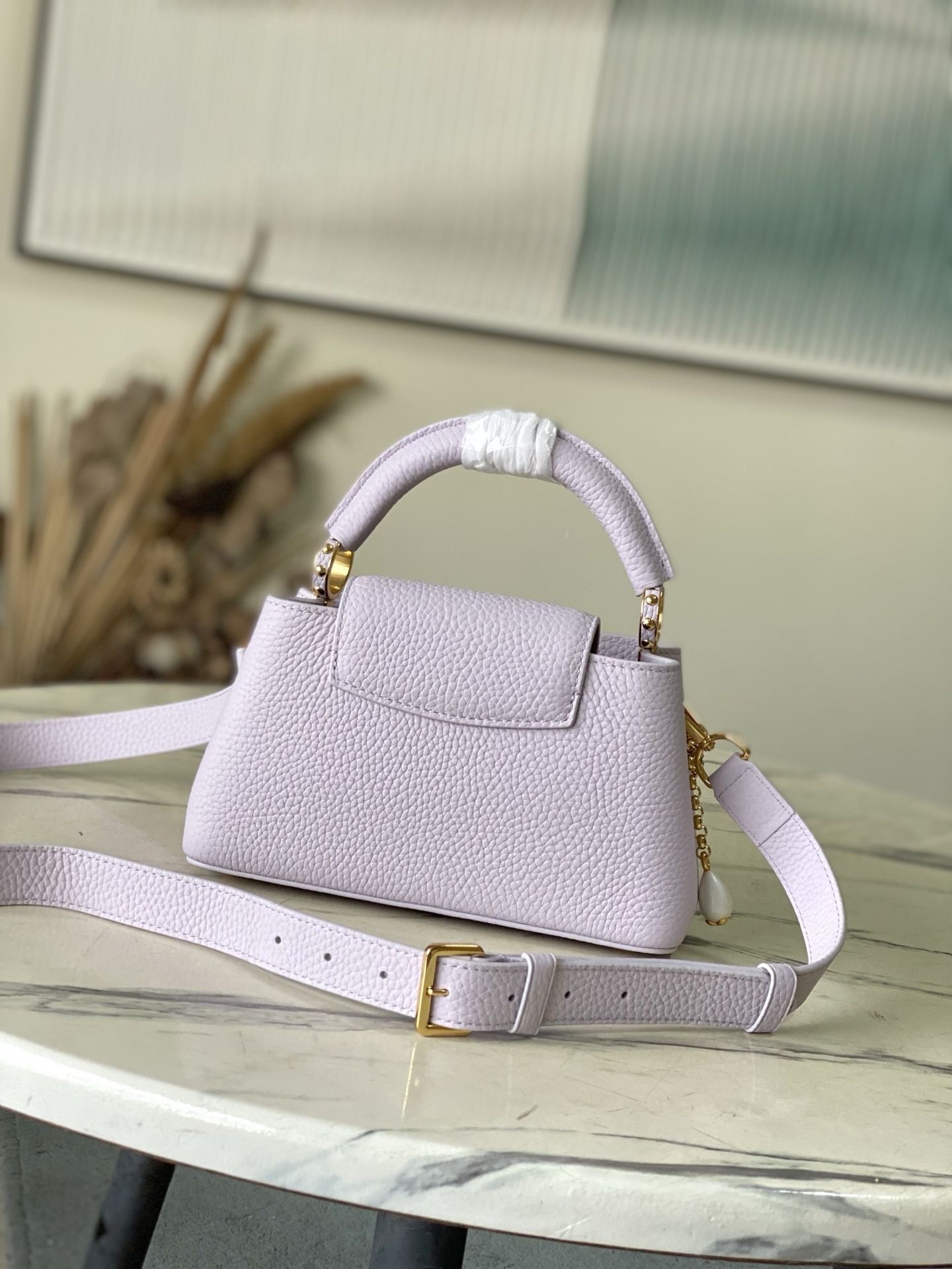 特级原厂皮 M25476 紫色迷你 本款Capucines迷你手袋向巴洛克风格珠宝汲取灵感,为链条融入贝