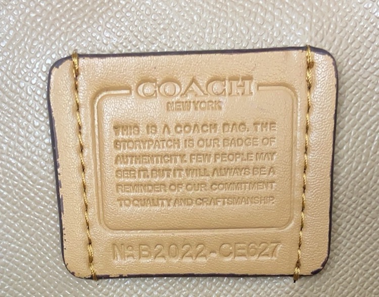 coa*h mollietote印花托特包 三隔层デザインの実用的トートバッグ